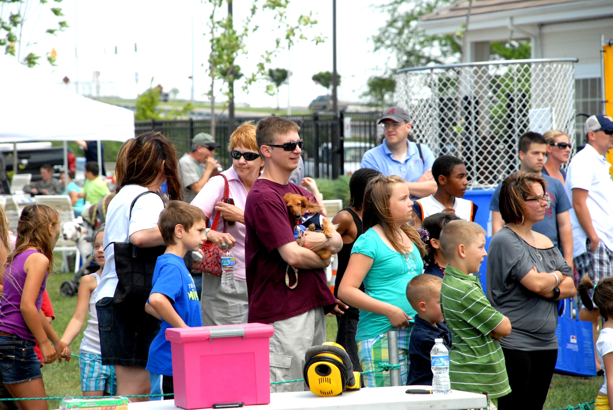 Team Dover members wait in line for one of the many rides at the Pet Extravaganza and Block Party at Eagle Heights May 8. There were many events for the pets of Team Dover during the Pet Extravaganza portion of the day, which allowed for the animals to socialize with other animals.  (U.S. Air Force photo/Airman 1st Class Matthew Hubby)