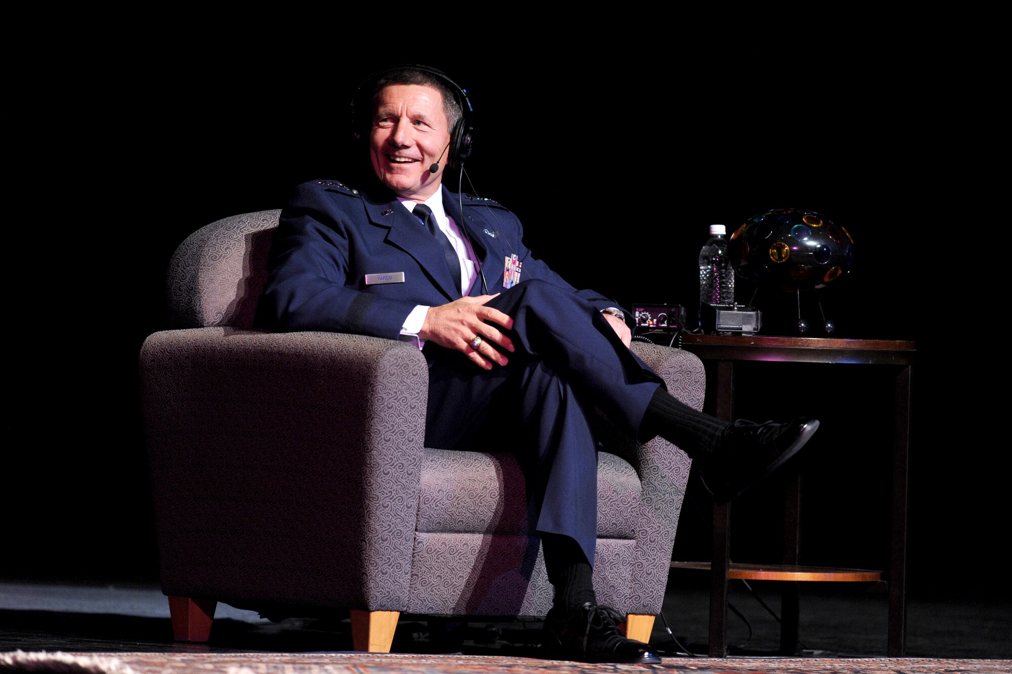 Lt. Gen. Michael Gould interacts with the host, judge and panel of NPR's "Wait, Wait ... Don't Tell Me!" comedy news quiz May 6, 2010. General Gould, the Air Force Academy superintendent, correctly answered two of three questions about Eton College in England to win a prize for Dan Condon of Boulder, Colo. (U.S. Air Force photo/Johnny Wilson)
