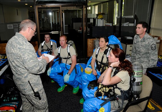 Members of the Air National Chemical, Biological, Radiological and Nuclear (CBRNE) Challenge Team are debriefed following the completion of an exercise scenario at the 188th Fighter Wing April 28, 2010, in preparation for this week's Air Force-wide CBRNE competition held at the Center of National Response in West Virginia. (U.S. Air Force photo by Senior Master Sgt. Dennis Brambl/188th Fighter Wing Public Affairs) 