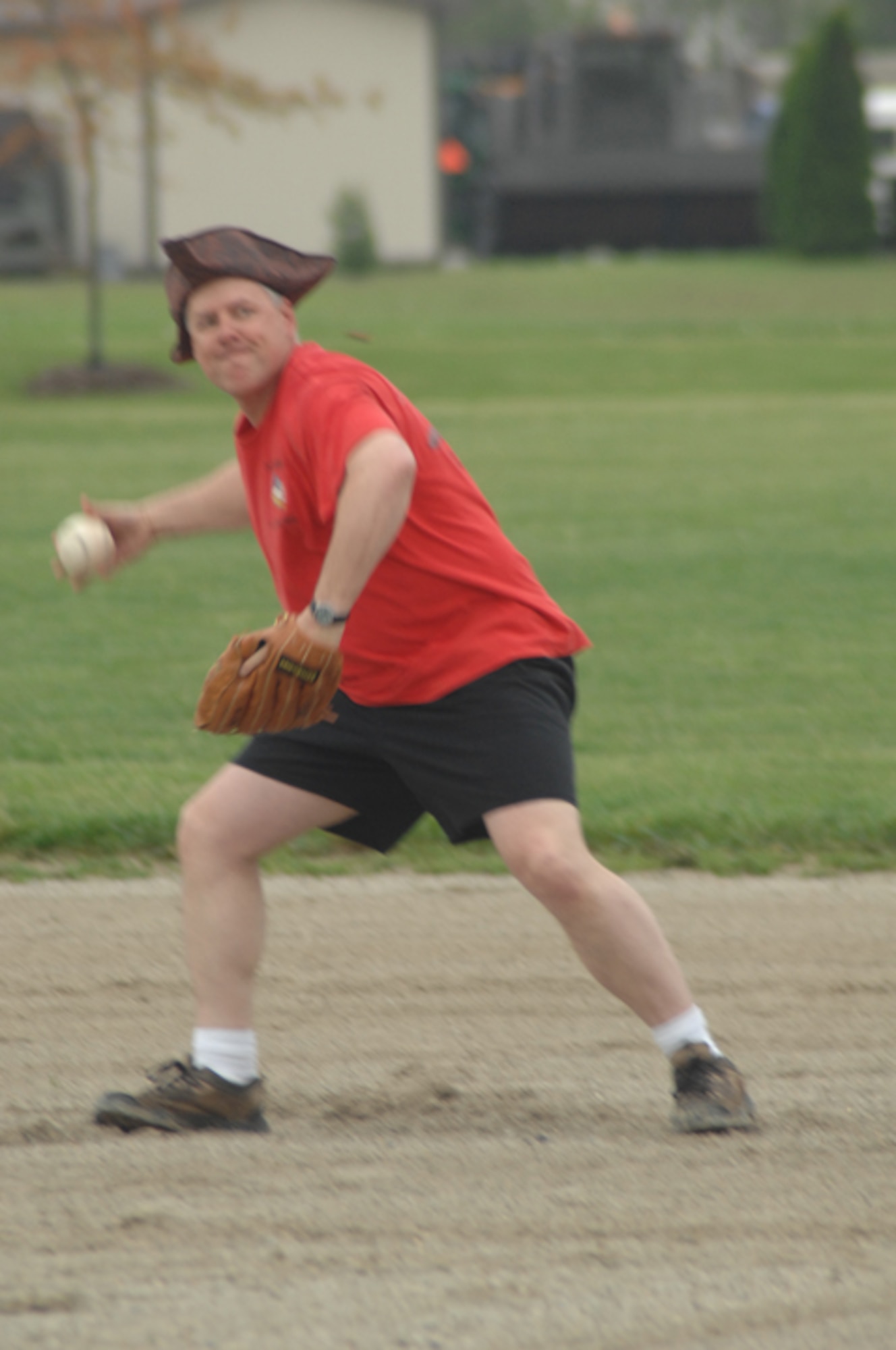 GRISSOM AIR RESERVE BASE, Ind., -- Second baseman Paul Wietbrock scoops up the ball and preapres to fire to first during the annual Jovanovich Cup softball game.  (U.S. Air Force photo/Tech. Sgt. Doug Hays)
