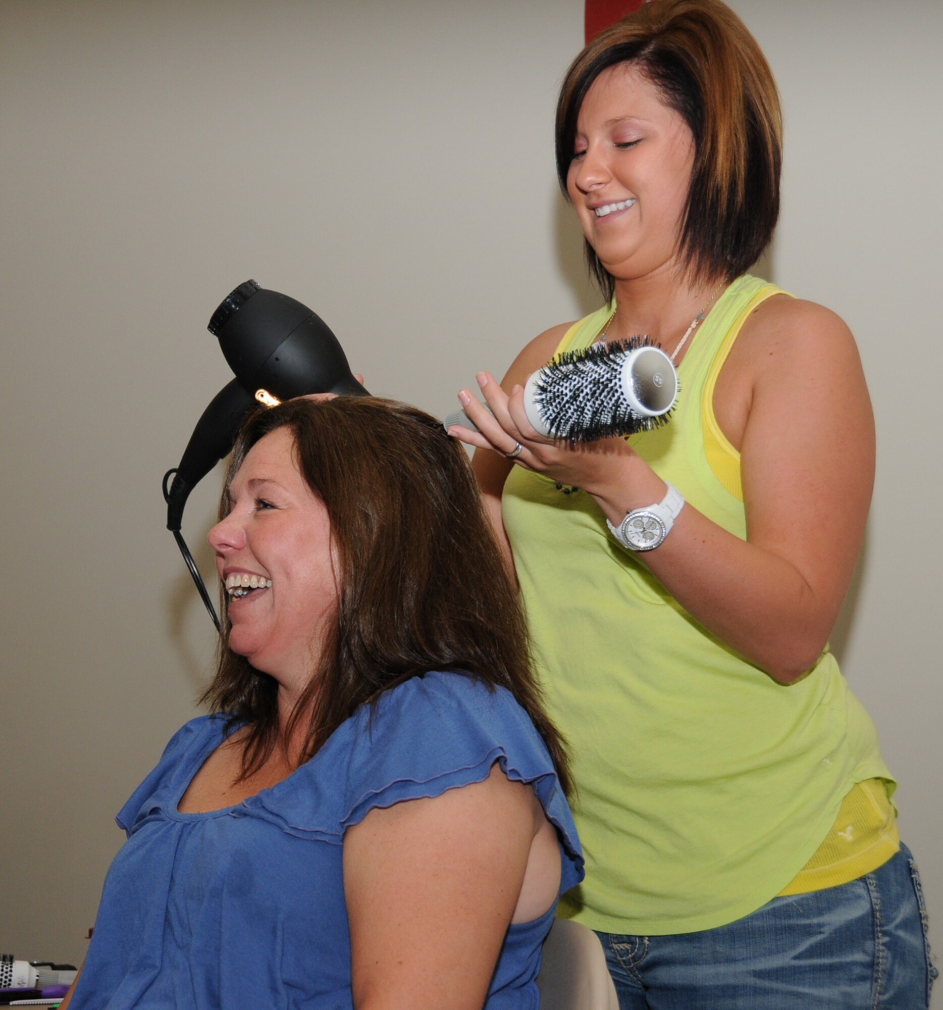 Libby Hayes has her hair styled by Jessica Favre, a student at Chris’ Beauty College.  Mrs. Hayes is married to Col. Bart Hayes, 81st Medical Group.  (U.S. Air Force photo by Kemberly Groue)