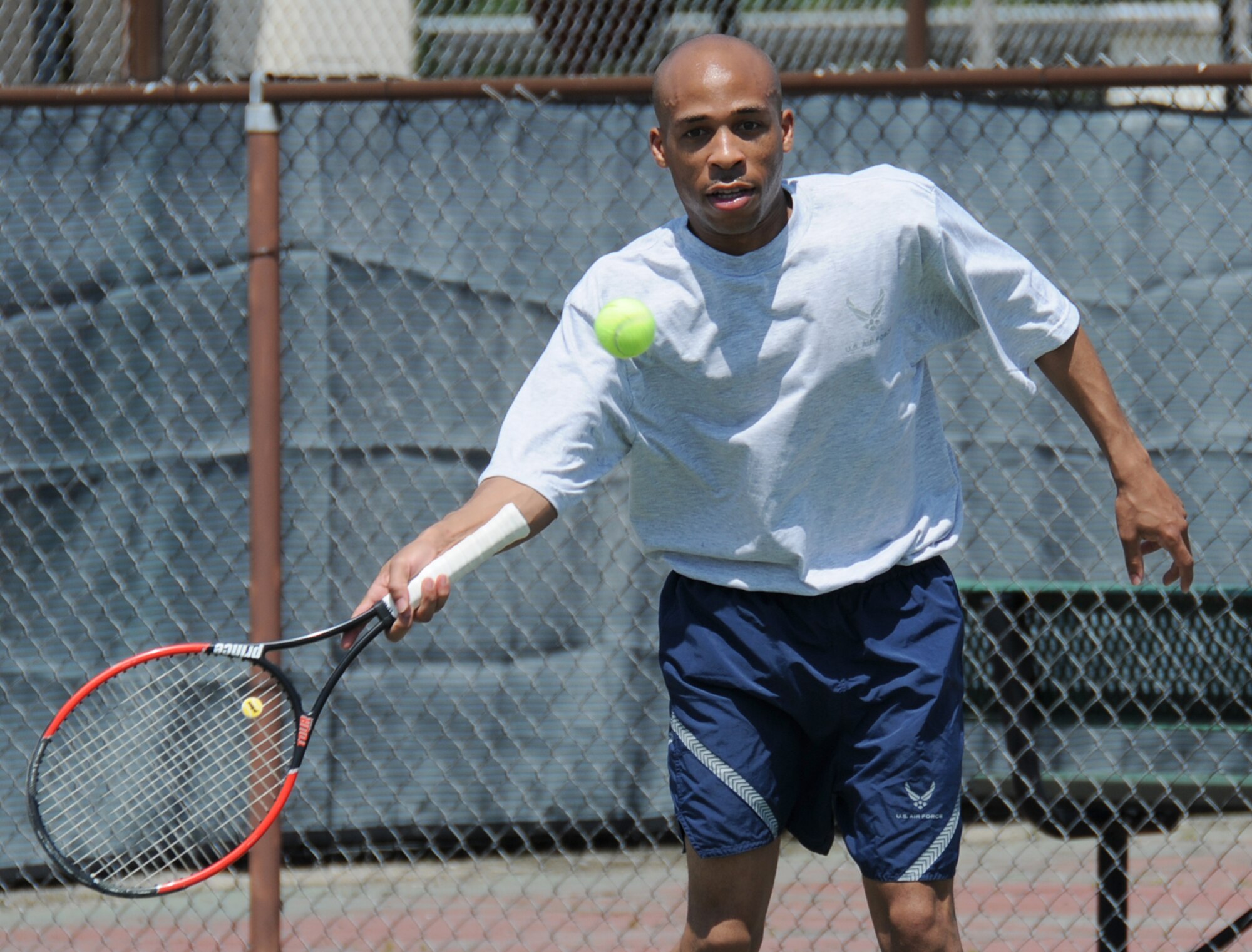 Nathaniel Sheppard, 81st Medical Support Squadron, plays in a tennis match during Sports Day, May 7.  (U.S. Air Force photo by Kemberly Groue)