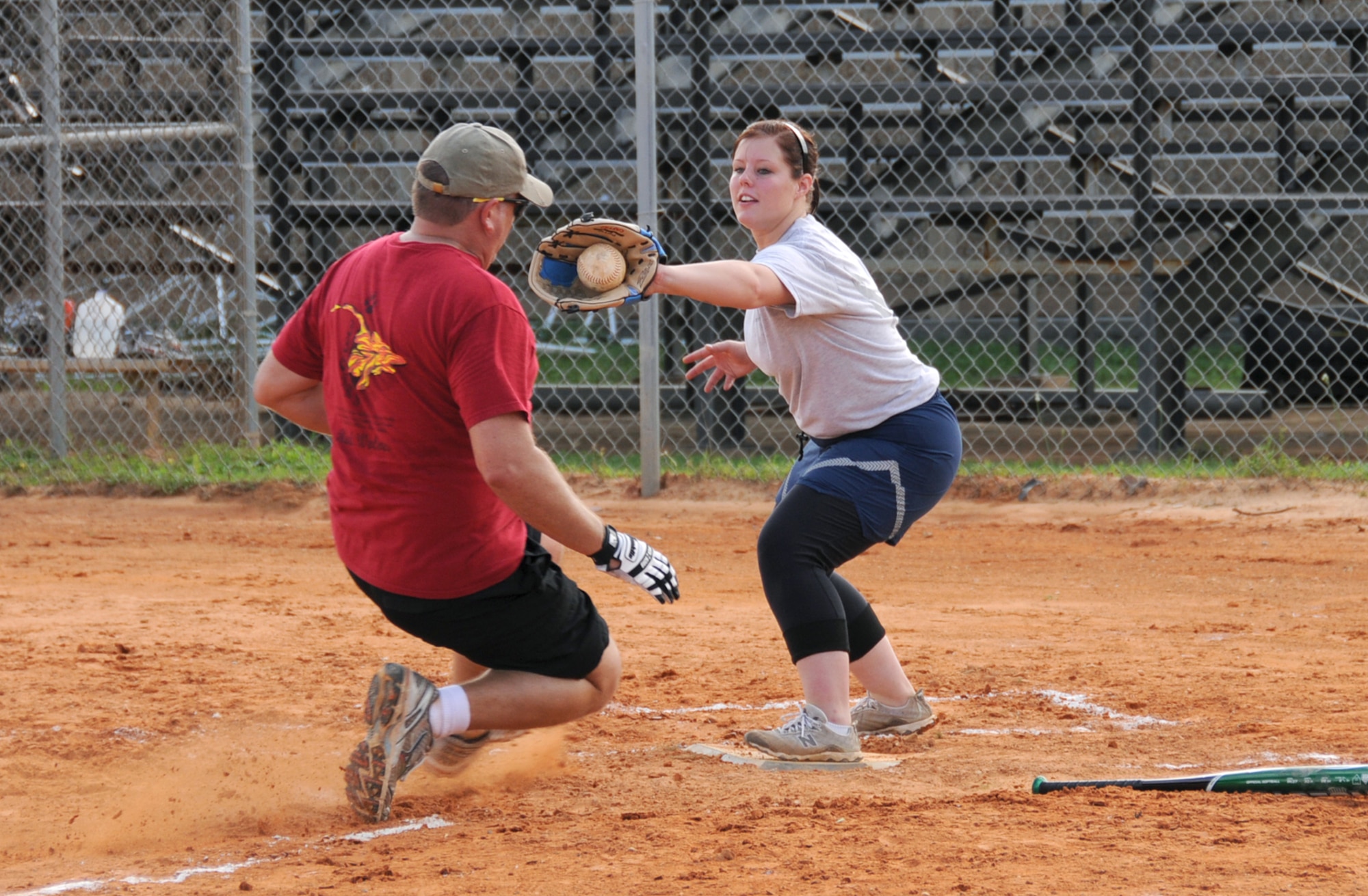 Catcher Natasha Cocchiarella, 81st LRS, tags out Terrance Owens, 336th TRS, in a softball matchup.  (U.S. Air Force photo by Kemberly Groue)