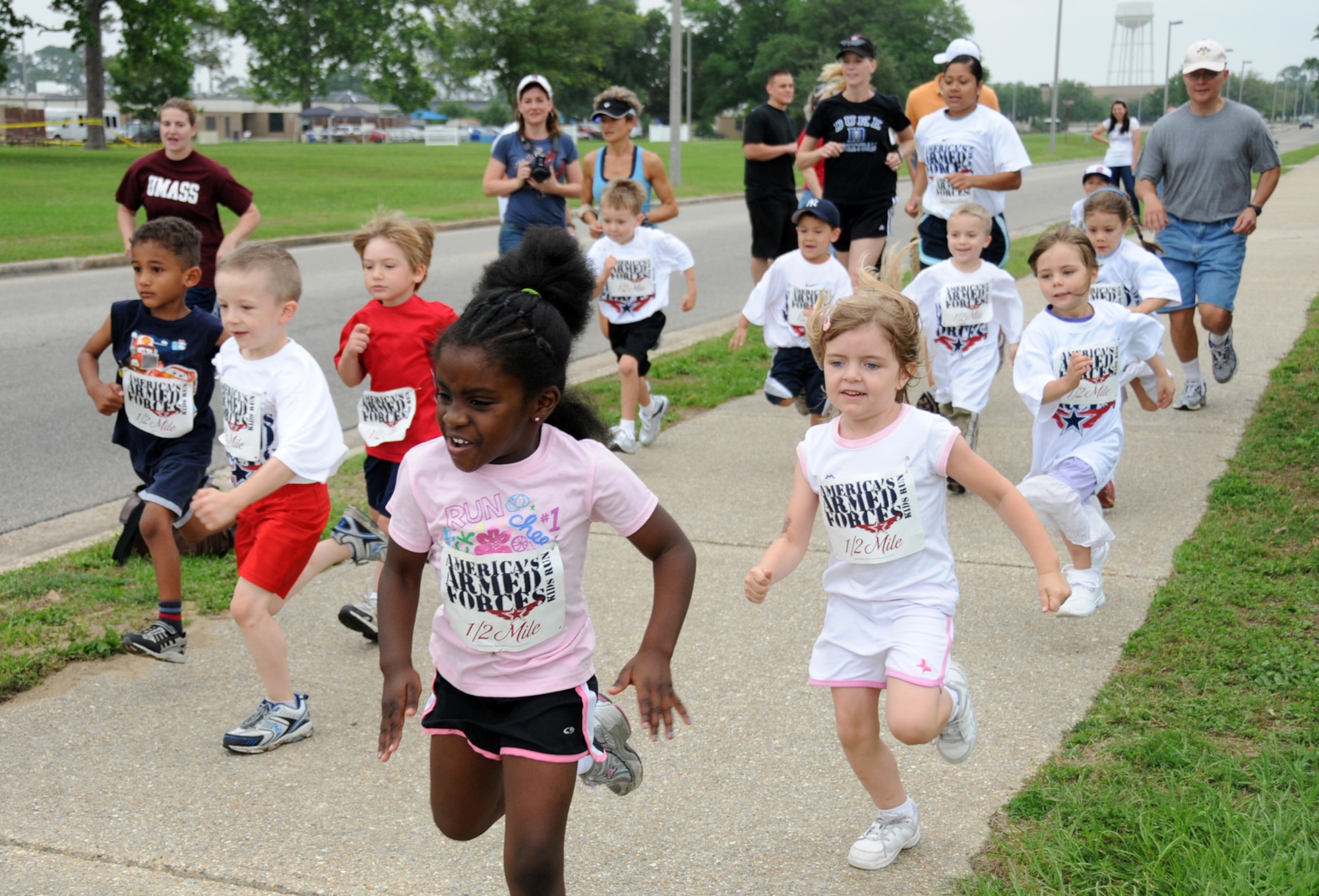 Keesler 5 and 6-year-olds run a half mile during the 8th annual America’s Armed Forces Kids Run Saturday.  Children ages 7 and 8 ran 1 mile and ages 9-13 ran 2 miles.  Children at 178 Army, Navy and Air Force installations were expected to participate.  (U.S. Air Force photo by Kemberly Groue)