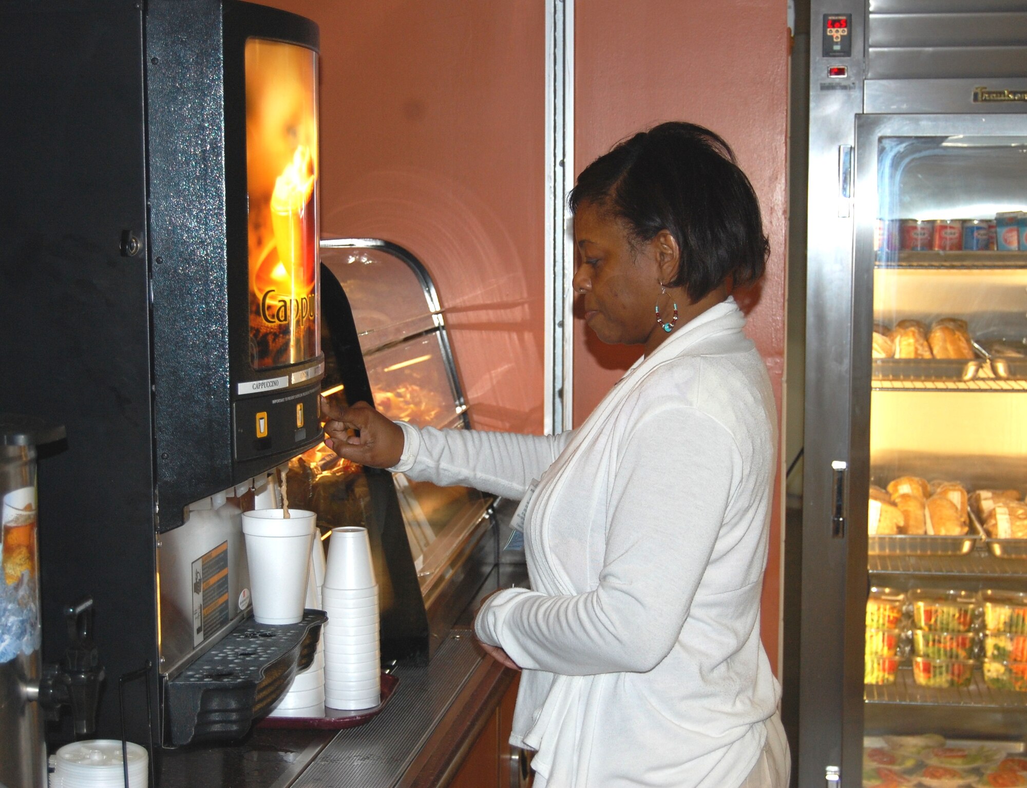 Althea Shoulders, 81st Medical Support Squadron, is one of the first customers to take advantage of The Dragon’s Nook, the new “grab-and-go” food service provided within the main entrance of the Medical Group’s Hungry Dragon Cafeteria.  The Nook offers a variety of to-go food items, such as coffee, tea, salads and sandwiches.  The Dragon’s Nook is open 8:30-10:30 a.m. and 2-5:30 p.m. Monday-Friday, and additionally from 6:30-8 a.m. and 11 a.m.-1 p.m. on non-training Fridays.  The service is closed in the afternoons on 81st Medical Group warrior training days.  (U.S. Air Force photo by Steve Pivnick)
