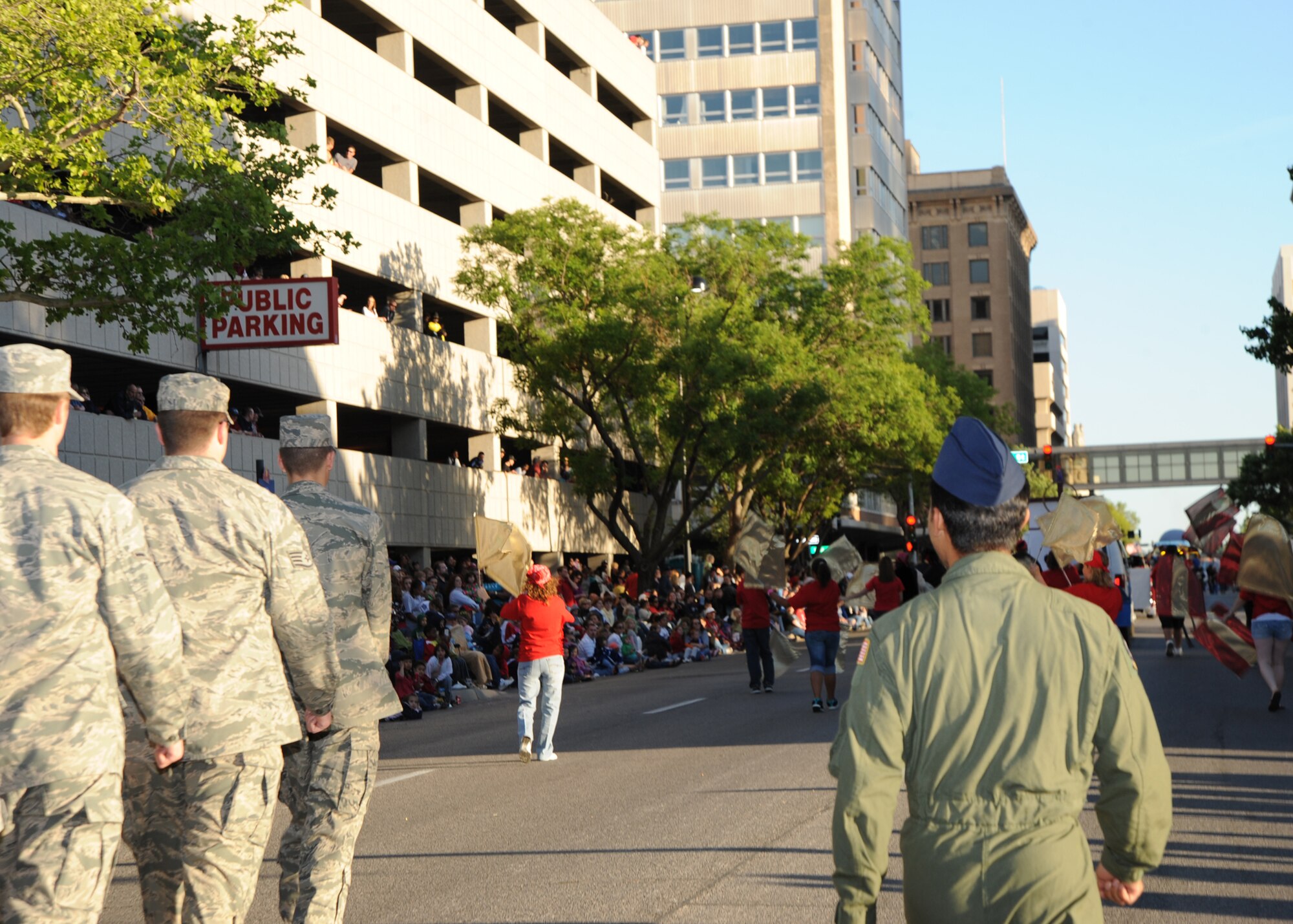 McConnell Airmen march during the annual Sundown Parade May 7, 2010, downtown Wichita, Kan. Airmen marched under traditional military cadence in front of an estimated 40,000 onlookers to help kick off the Wichita River Festival. The base is host to more than 5,600 Airmen, Guardsmen, Reservists and civilian employees, and in fiscal year 2009, McConnell generated more than $450 million into the local economy.  (U.S. Air Force photo/Airman 1st Class Andrea Salazar)