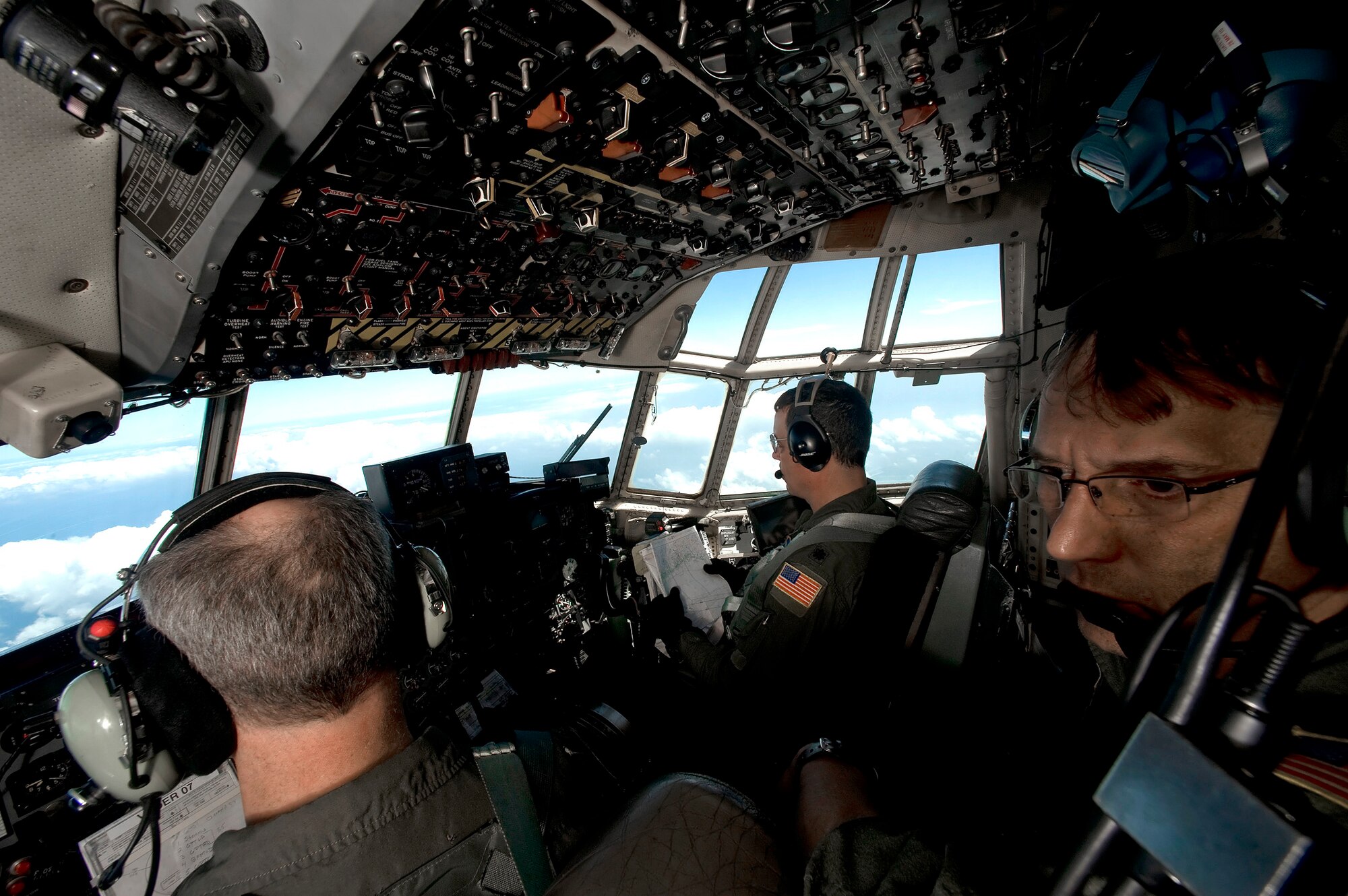 Master Sgt. Archie Archambault looks for oil while flying in a C-130 Hercules over the Gulf of Mexico May 7, 2010. Sergeant Archambault is a flight engineer from the Air Force Reserve Command's 910th Airlift Wing at Youngstown-Warren Air Reserve Station, Ohio.  (U.S. Air Force photo/Tech. Sgt. Adrian Cadiz)
