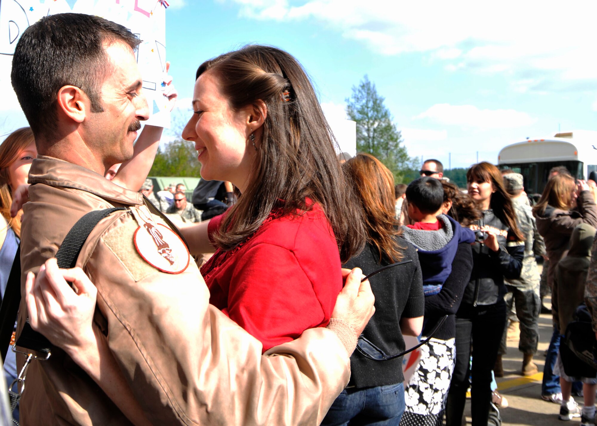 Capt. David Levene, 494th Fighter Squadron F-15 E Weapons Systems officer embraces his wife, Tiffany, at Hangar 6 at RAF Lakenheath upon returning from a four-month deployment to Bagram Air Base, Iraq May 6. (U. S. Air Force photo by Airman 1st Class Tiffany M. Deuel)