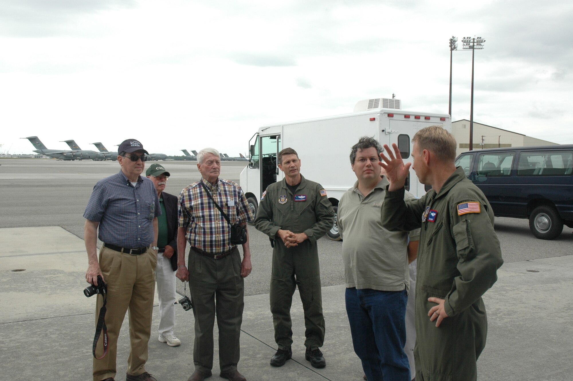 Msgt Don Rix and Lt. Col Kevin McManus answer some questions about the plane during the St. Johns Mens Group tour.