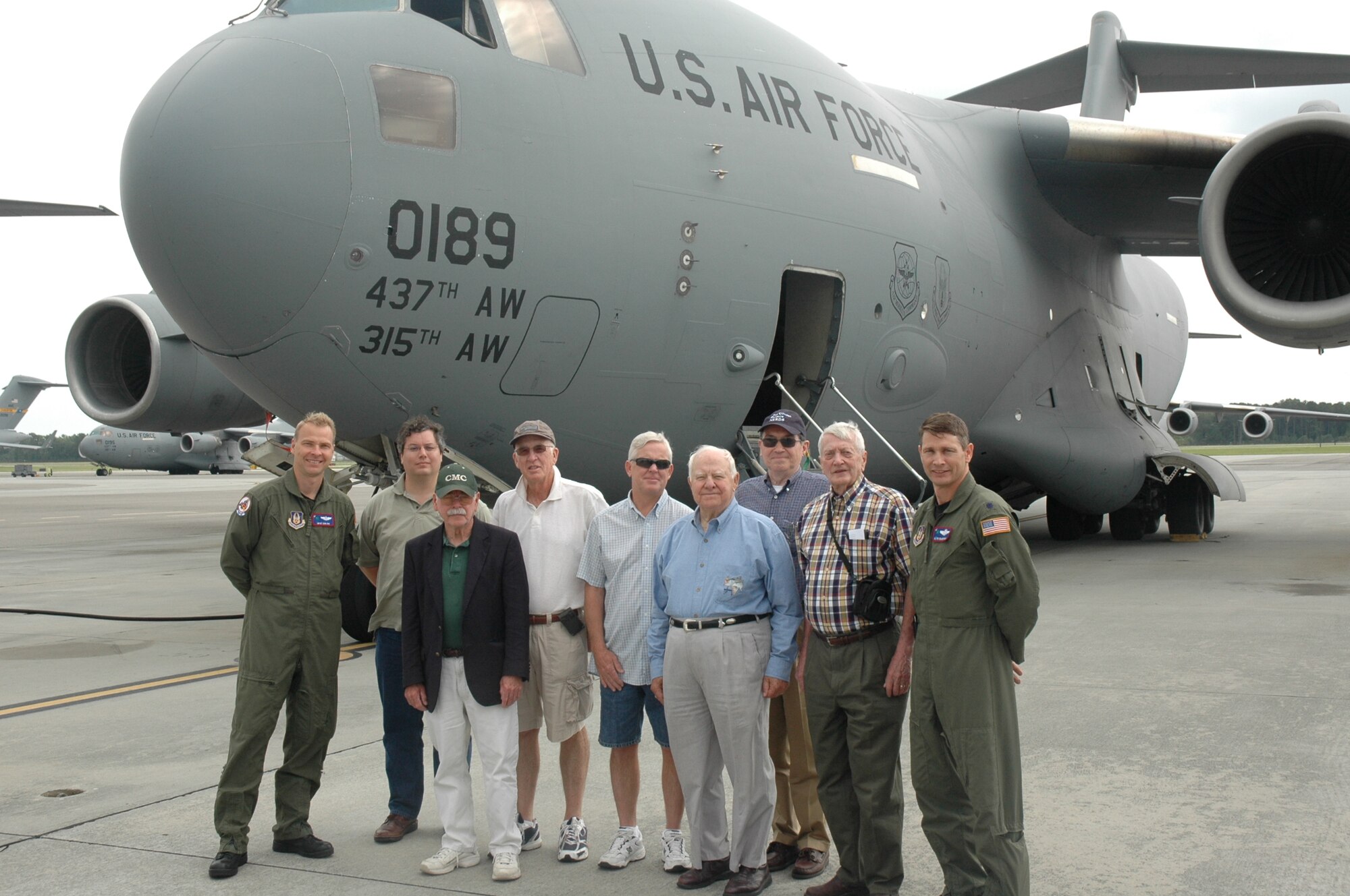 Lt. Col Kevin Mcmanus and MSgt Don Rix pose infront of the C-17 with the St. Johns Mens Group from Charleston.  Lt. Col Mcmanus and MSgt Rix gave them a tour of the C-17 on Tuesday, May 11, 2010.