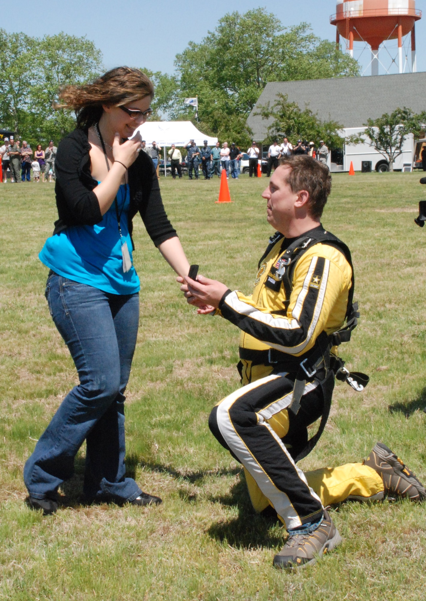Detective Carmine Czapla, 87th Security Forces Squadron, proposes to his fiancé, Jessica Ruzicka after he landed from a tandem jump with the Golden Knights. “I will,” she said. (U.S. Navy photo/Sherry Jacob)