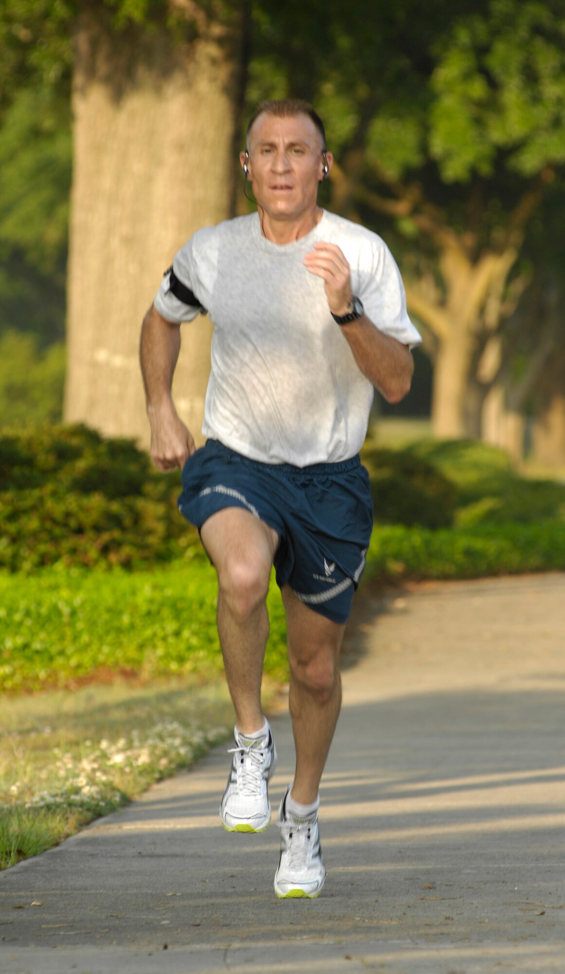 U.S. Air Force Master Sgt. Mike Bunting finsihes first during the Commander's Fitness Challenge on Joint Base Charleston, S.C., May 7, 2010. This month's run was shortened due to construction in areas where the run normally passes through. Sergeant Bunting finished the 2.5 mile course in 13 minutes and 16 seconds. Sergeant Bunting is with the 315th Maintenance Squadron. (U.S. Air Force Photo/Airman 1st Class Lauren Main) 