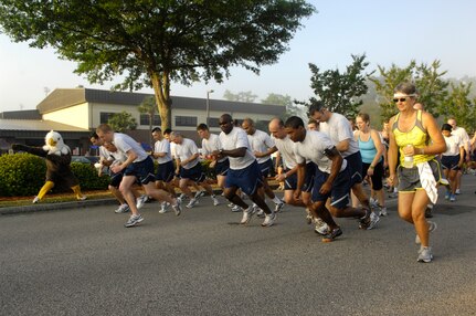 Airmen dash off as the horn sounds at the beginning of the Commander's Fitness Challenge on Joint Base Charleston, S.C., May 7, 2010. May is fitness month and the base fitness center is currently holding events which are set to run all month long. Airmen can earn points by attending the events and at the end of the month there will be a grand prize giveaway for the individual with the most points. This month's run was shortened due to construction in areas where the run normally passes through. The course was 2.5 miles. (U.S. Air Force Photo/Airman 1st Class Lauren Main)