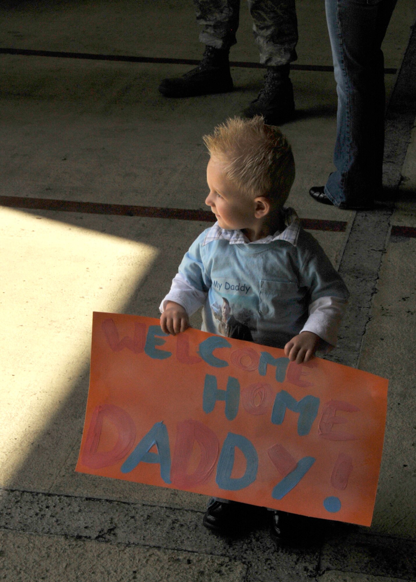 Logan, 19 months, waits in Hangar 6 at RAF Lakenheath for his father, Staff Sgt. Jason Siler, 494th Fighter Squadron crew chief, to return from his four-month deployment to Bagram Air Base, Afghanistan May 6. Sergeant Deveau was the last of two groups to arrive. (U.S. Air Force photo/Airman 1st Eboni Knox)