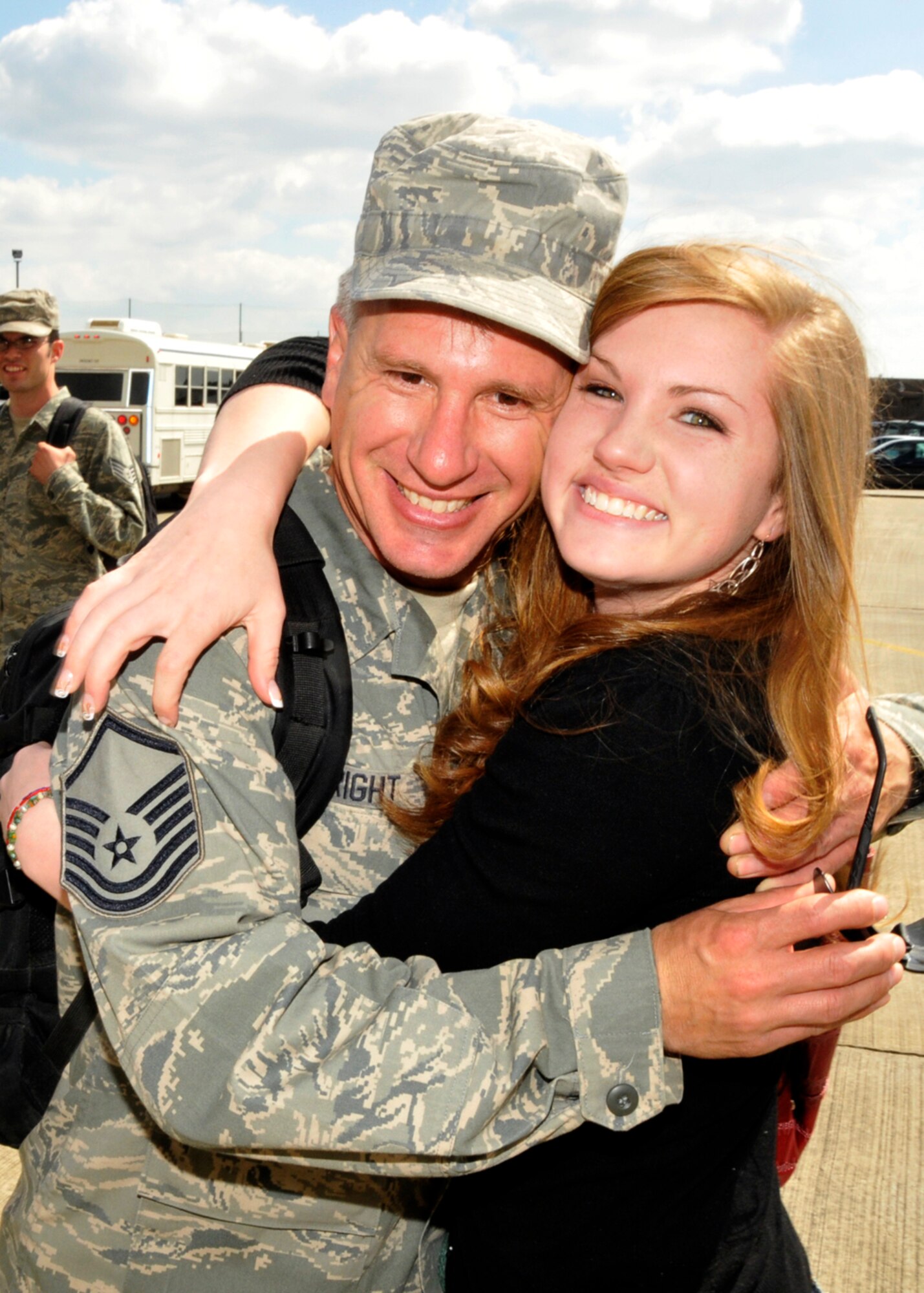 Master Sgt. Walter Wright, 48th Civil Engineer Squadron assistant chief of operations, is welcomed home by his daughter, Taylor, 18, after arriving home from a four-month deployment to Bagram Air Base, Afghanistan May 6. Sergeant Wright’s group was one of the first to return home. (U.S. Air Force photo/Airman 1st Eboni Knox)