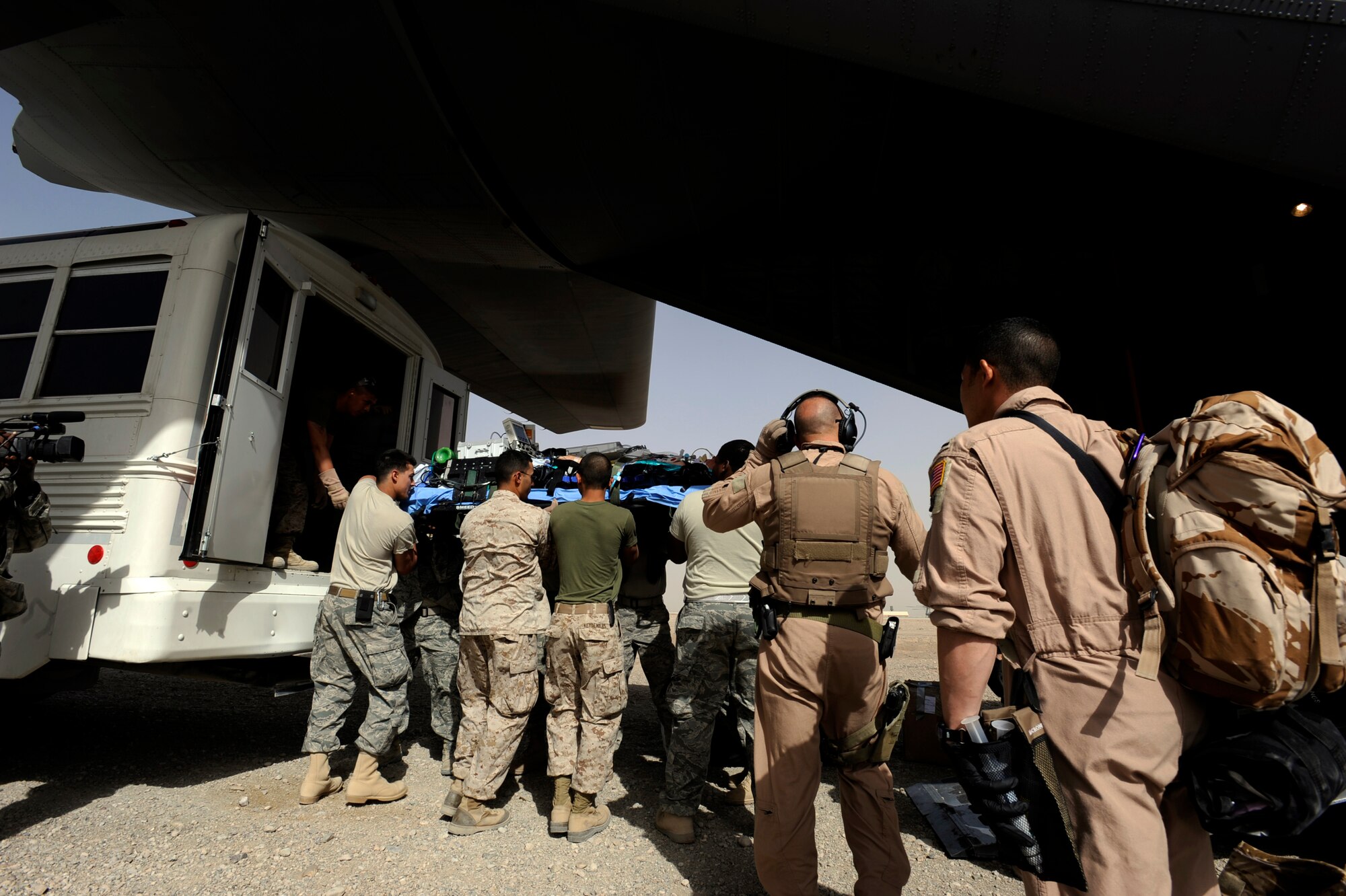 A patient is loaded onto a C-130 Hercules assigned to the 774th Expeditionary Airlift Squadron at Bagram Airfield, Afghanistan, April 20, 2010, at Camp Bastion, Afghanistan. One of the most vital airlift missions is aeromedical evacuation (AE). AE teams carry equipment for nearly every scenario: stretchers, stretcher racks, defibrillators, suction machines, IVs, oxygen tanks and other medical equipment that help save lives and move warfighters to higher medical care. The aircrew is from California Air National Guard?s 115th Airlift Squadron Channel Island National Guard Station at Port Hueneme, Calif. (U.S. Air Force photo/Staff Sgt. Manuel J. Martinez/released)
