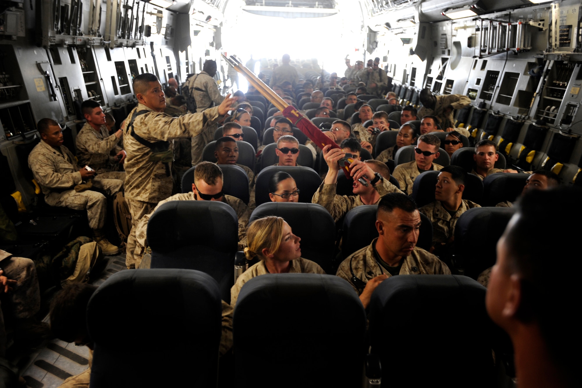 U.S Marines board a C-17 Globemaster III, April 20, 2010, at Camp Bastion, Afghanistan. Airmen helped deliver 30,000 troops into the region as part of the surge throughout Afghanistan, since Jan. 1, also they have ensured more than 25,000 customers got on their way to their various destinations throughout Southwest Asia. (U.S. Air Force photo/Staff Sgt. Manuel J. Martinez/released)