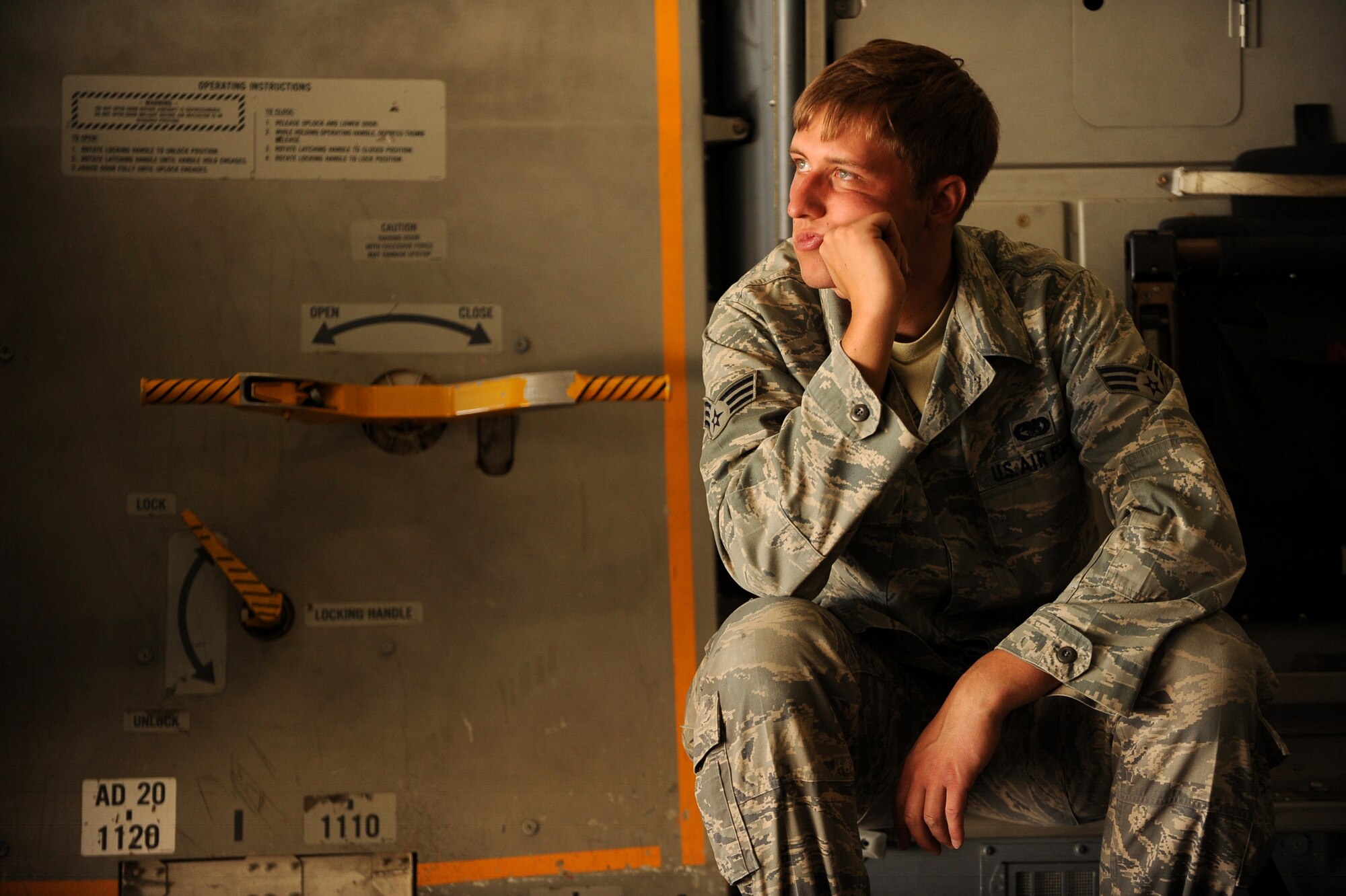 Senior Airman Joshua Faust, an aerial porter assigned to 451st Expeditionary Logistics Readiness Squadron's Detachment 1, waits for cargo to arrive for transport aboard C-17 Globemaster III, April 20, 2010, at Camp Bastion, Afghanistan.  (U.S. Air Force photo/Staff Sgt. Manuel J. Martinez/released)