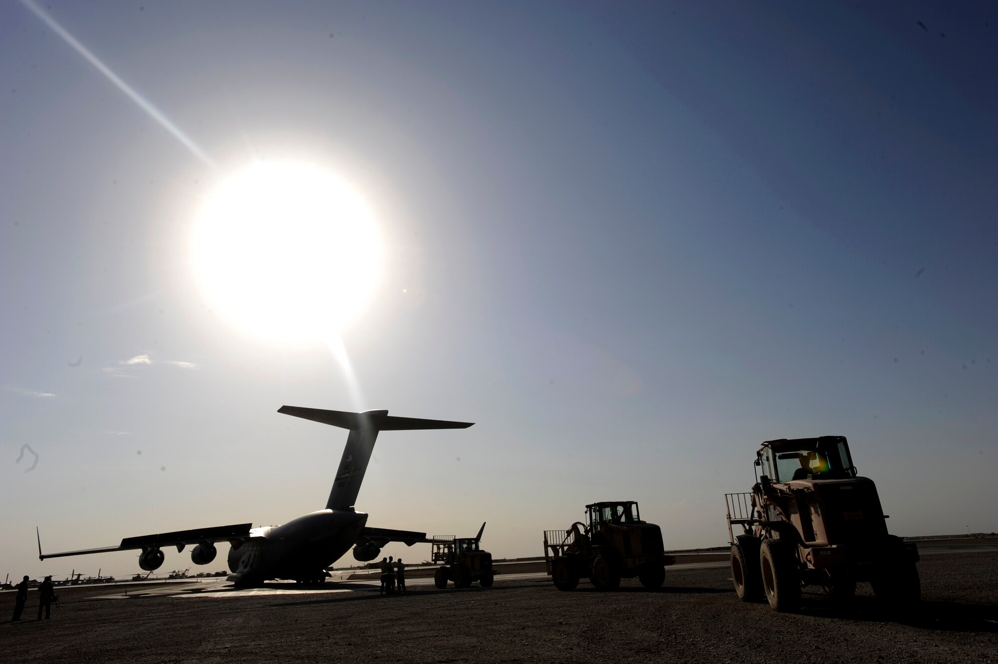 Aerial porters assigned to 451st Expeditionary Logistics Readiness Squadron's Detachment 1, prepare to download pallets from a C-17 Globemaster III, April 20, 2010, at Camp Bastion, Afghanistan. (U.S. Air Force photo/Staff Sgt. Manuel J. Martinez)