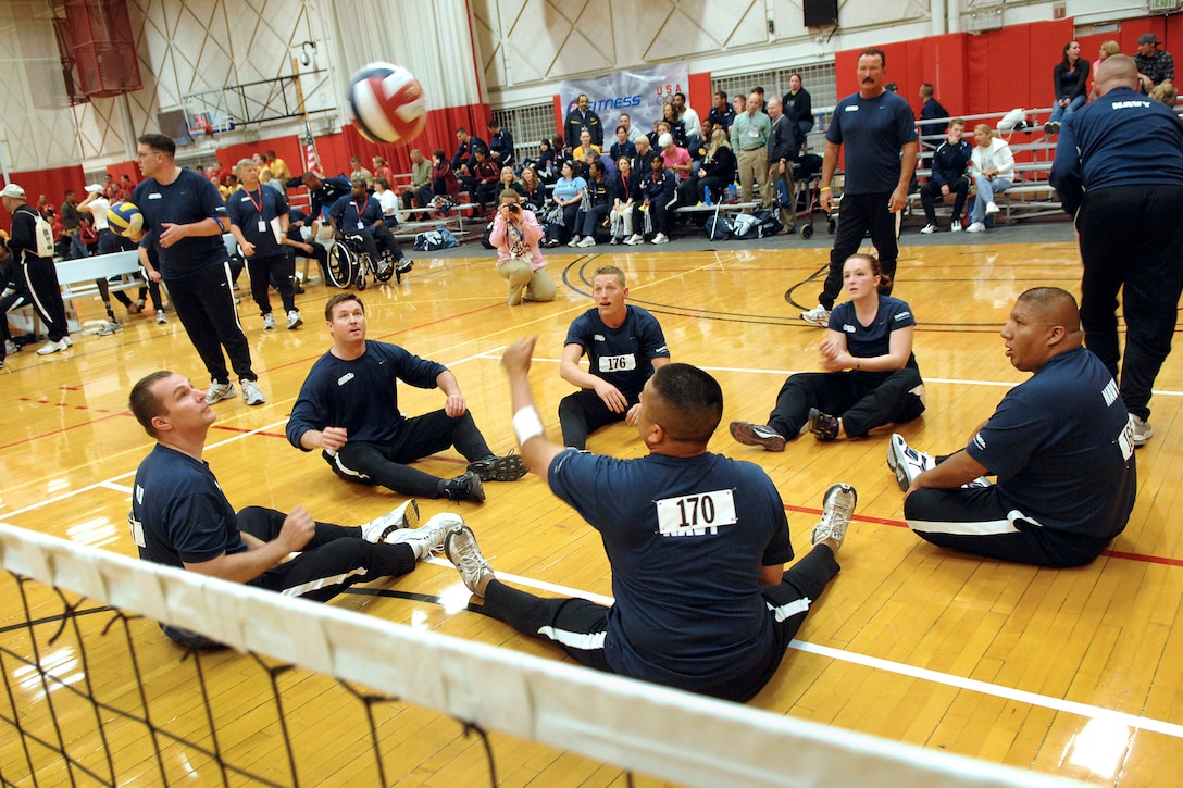 The U.S. Navy sitting volleyball team warms up for a match at the U.S. Olympic Training Center in Colorado Springs, Colo., May 11, 2010. The team is part of the inaugural Warrior Games competition May 10-14, which features wounded warriors and disabled veterans taking part in paralympic-type competition.