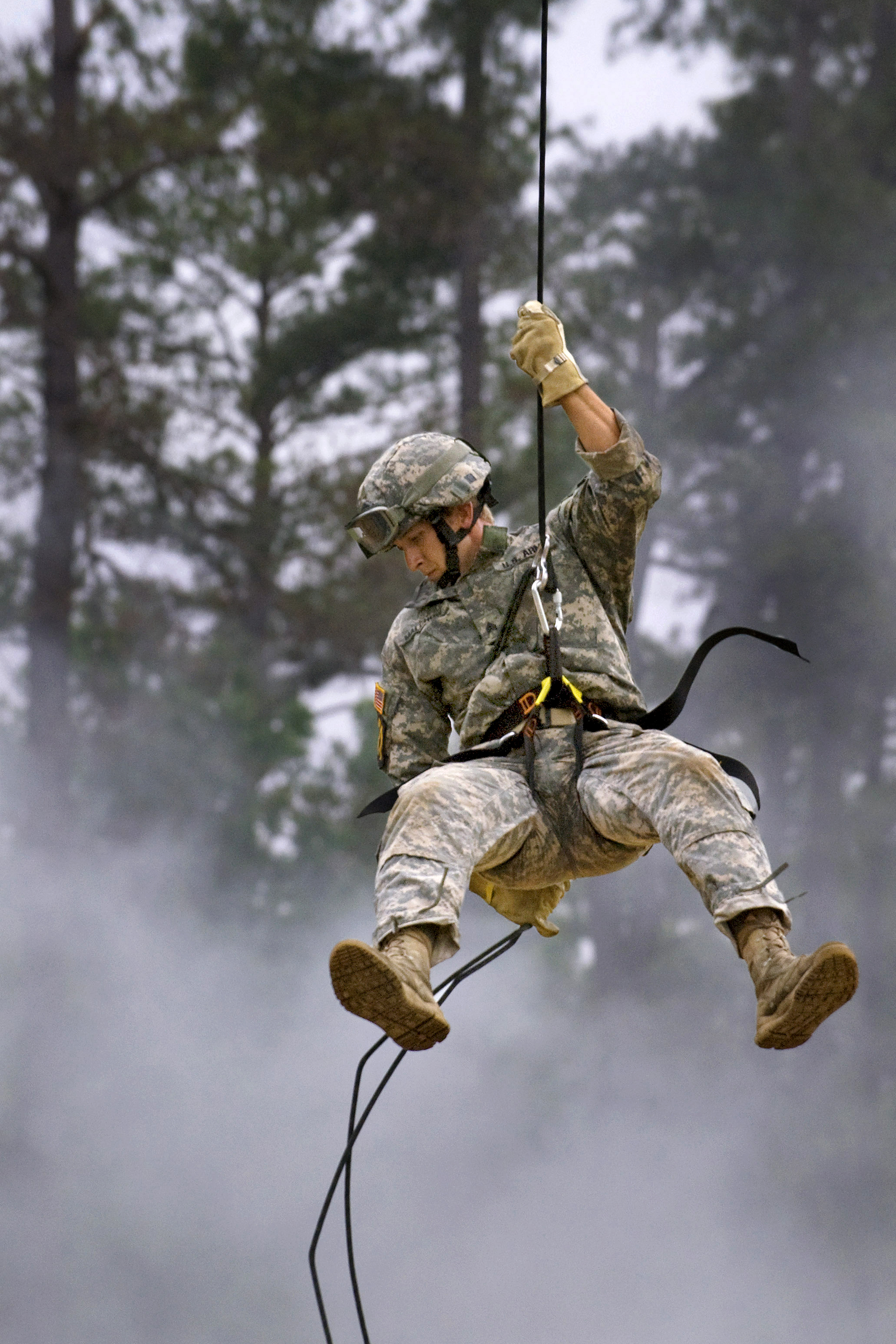 U.S. Army Sgt. Michael Malchow descends to the bottom of the rappel tower  as part of