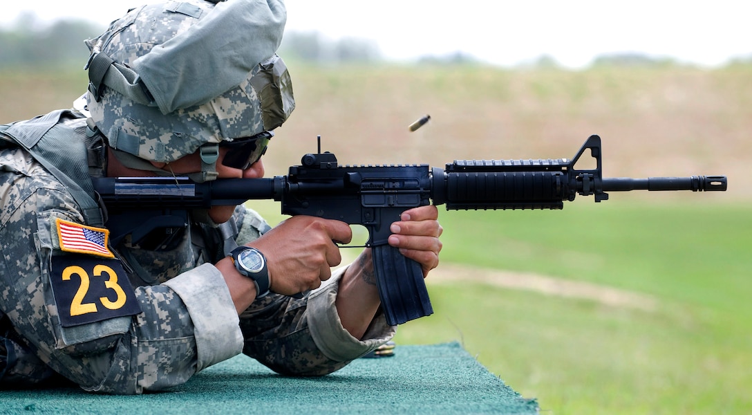 U.S. Army Staff Sgt. Eugene Mirador sends a round down range during the moving target event in the 2010 Best Ranger Competition, Camp Darby, Fort Benning, Ga., May 07, 2010. Mirador is assigned to the 75th Ranger Regiment. Teams competed in three shooting events during the second day of competition to include a stress shoot, and a machine gun shoot.