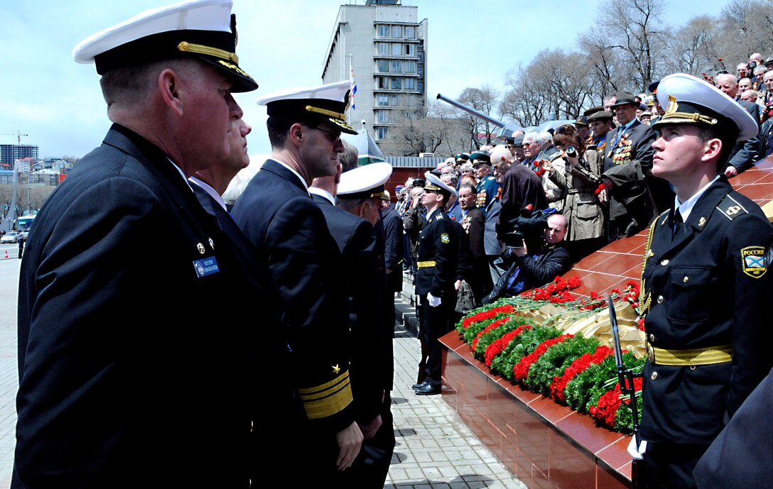 U.S. Navy Vice Adm. John M. Bird, center, commander of U.S. 7th Fleet, and Capt. Rudy Lupton, left, commanding officer of the U.S. 7th Fleet command ship USS Blue Ridge take a moment after laying flowers at the Battle of Glory of the Russian Federation Pacific Fleet Memorial during a ceremony in Vladivostok, Russia, May 8, 2010. The commemoration ceremony marked the 65th anniversary of Victory Day, a national holiday in Russia celebrating the end of World War II.