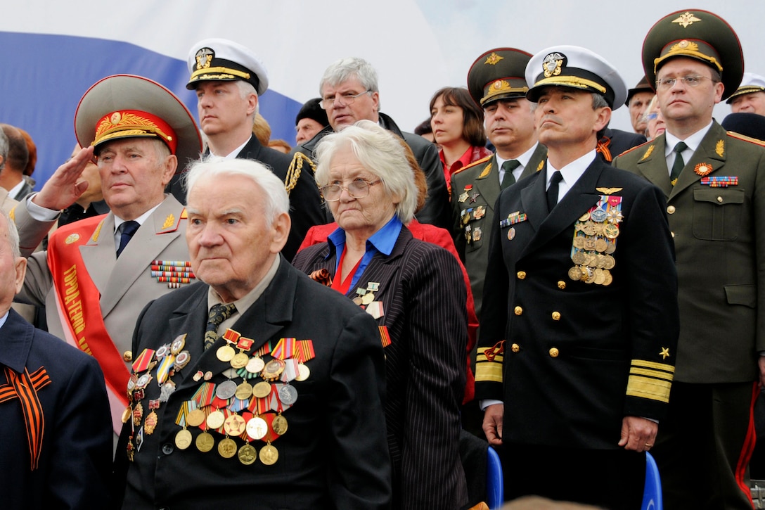 U.S. Navy Vice Adm. Harry B. Harris Jr., commander of U.S. 6th Fleet, stands at attention among Russian war veterans during the opening ceremony at the 65th anniversary of the Victory in Europe Day parade in St. Petersburg, Russia, May 10, 2010. 