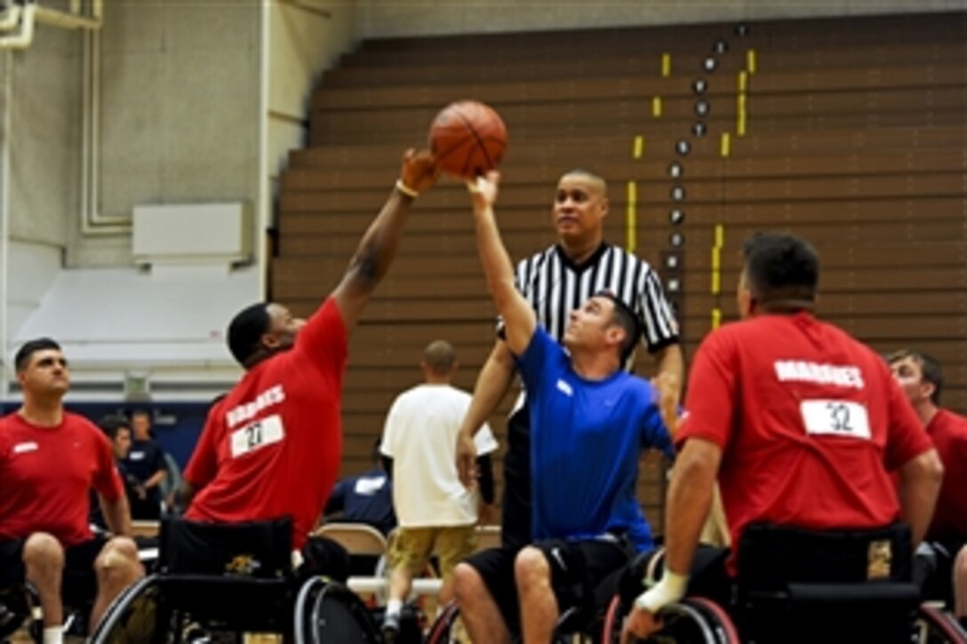 Members of Team Air Force try to get the ball during a game of basketball against the Marines during the inaugural Warrior Games at the U.S. Olympic Training Center in Colorado Springs, Colo., May 11, 2010. The competition runs through May 14.