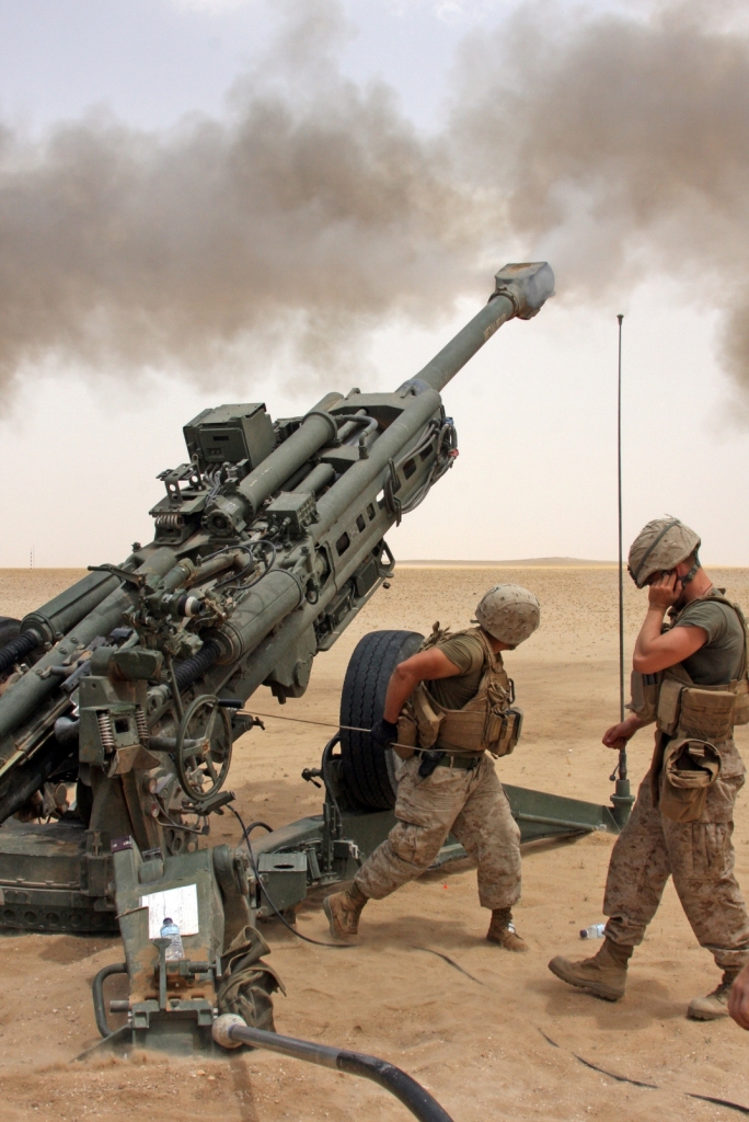 Marine Corps cannon crewmen, Bravo Battery, Battalion Landing Team 1st Battalion, 9th Marine Regiment, 24th Marine Expeditionary Unit endure unforgiving heat as they fire more than 200 rounds from their M777 A2 155 mm Howitzers during an artillery live fire range. This is only one of several training exercises the Marines of the 24th MEU have completed during their deployment throughout the Middle East.