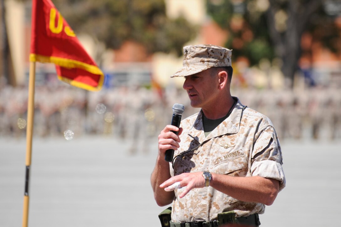 CAMP PENDLETON, Calif. - Col. Michael R. Hudson speaks to guests and service members after taking command of the11th Marine Expeditionary unit from Col. Gregg P. Olson here May 11. The new command marks the third time Hudson has been with a MEU in over 20 years of service as a Marine officer. (Photo by Gunnery Sgt. William T. Greeson)