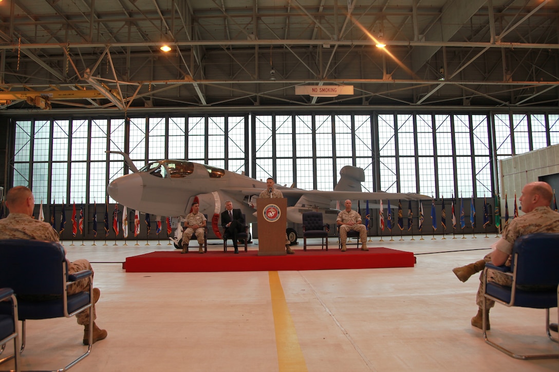 Maj. Gen. James F. Flock, commanding general of 2nd Marine Aircraft Wing, and Maj. Gen. Carl B. Jensen, commanding general of Marine Corps Installations East, watch from the front row as Col. Russell A. Sanborn, commanding officer of Marine Aircraft Group 14, heralds the addition of the Improved Capability III system to the EA-6B Prowler during a ceremony in Marine Transport Squadron 1’s hangar, May 13. “The ICAP III represents a revolutionary leap in capability for electronic warfare,” Flock said. “Not only does it provide increased electronic warfare jamming capabilities, it provides increased capabilities in integrating the airplane with the battlefield.”