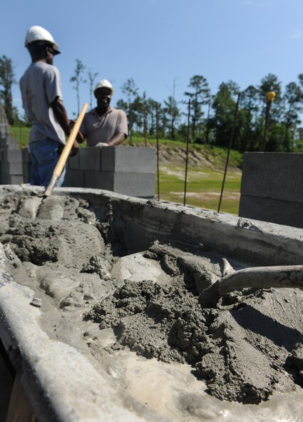 MOODY AIR FORCE BASE, Ga. -- Mortar waits to be used on the 300-foot divider wall that will sit between the indoor and outdoor ranges at the Combat Arms Training and Maintenance site here May 10. The indoor range will feature tactical baffles that catch rounds so there will be no need for a danger zone behind the range. (U.S. Air Force photo by Airman 1st Class Benjamin Wiseman/ RELEASED)
