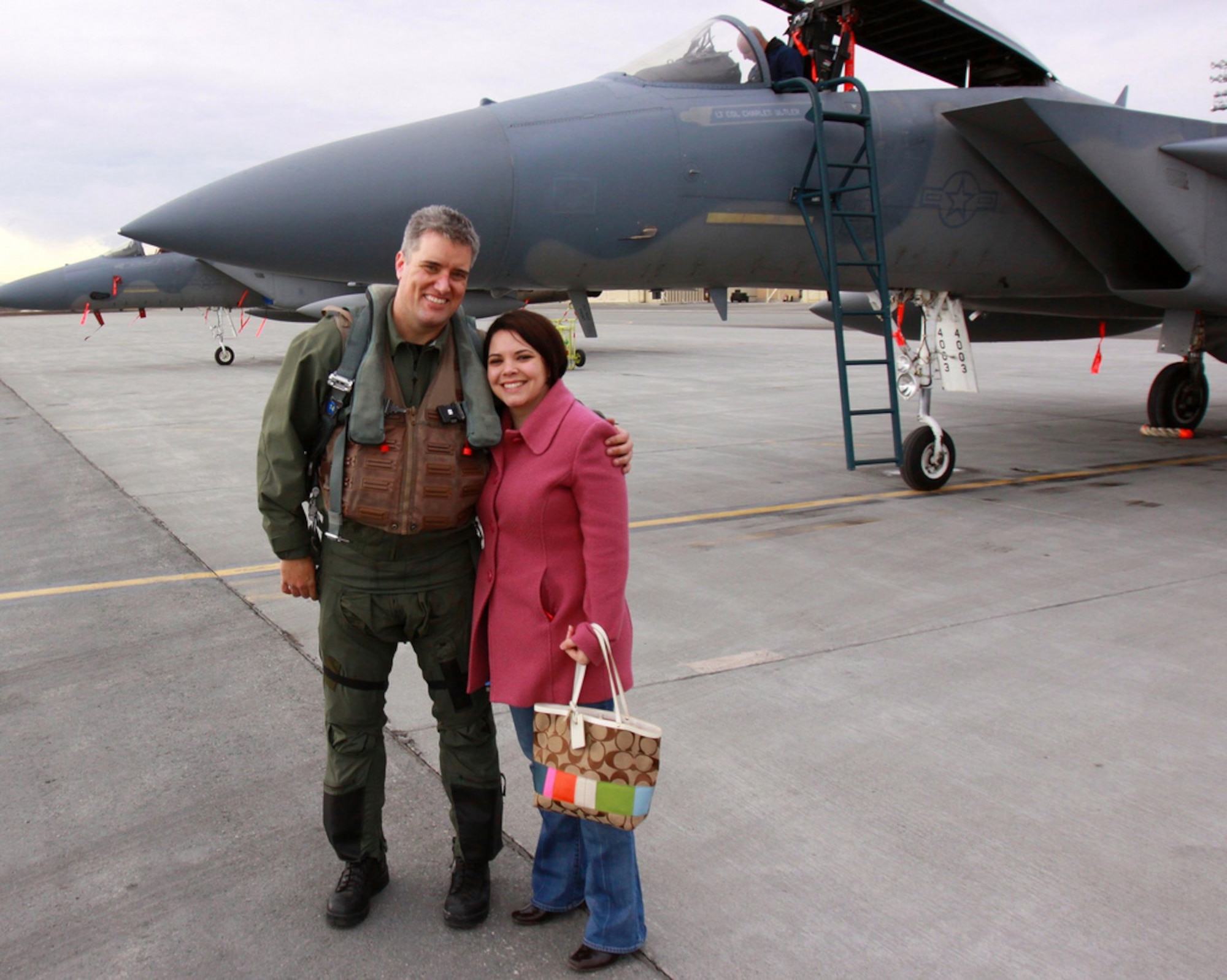 ELMENDORF AIR FORCE BASE, Alaska -- Retired Col. Capozzi, then a captain, with his wife Joanne and their daughter kati. Kati was the first baby born into the 19th TFS at Shaw in 1982 and she is married to the last pilot to be assigned to the 19 FS before it is deactivated in September.