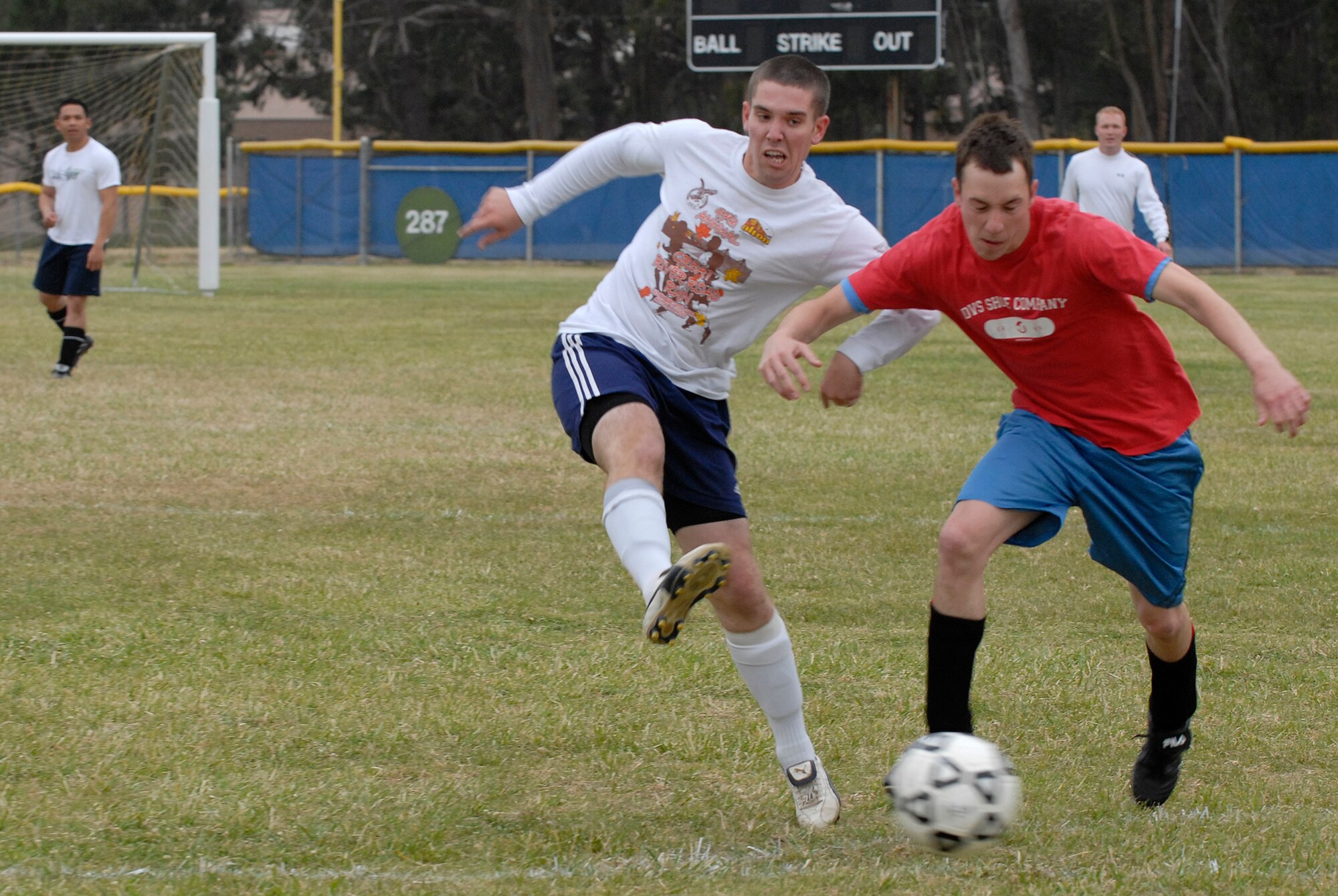VANDENBERG AIR FORCE BASE, Calif. -- Dan Mortenson, a 30th Launch Group team member, kicks the ball past Brandon Satre, 30th Space Communications Squadron team member, during an intramural soccer game at the base field here Wednesday, May 12, 2010.  The 30th Launch Group swept the game 9-0.  (U.S. Air Force photo/Senior Airman Andrew Satran) 

 


 

 
