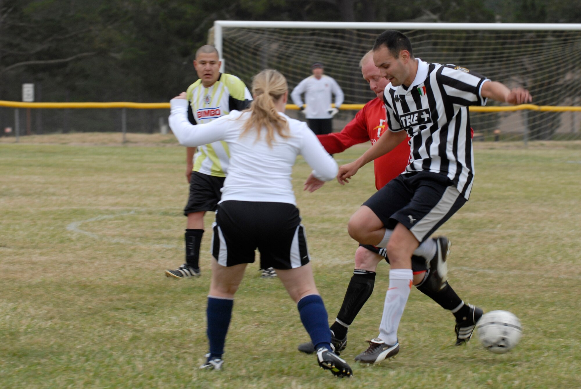 VANDENBERG AIR FORCE BASE, Calif. -- The 30th Launch Group team members defend the mid-field against the 30th Space Communications Squadron during an intramural soccer at the base field here Wednesday, May 12, 2010.  (U.S. Air Force photo/Senior Airman Andrew Satran)

 
