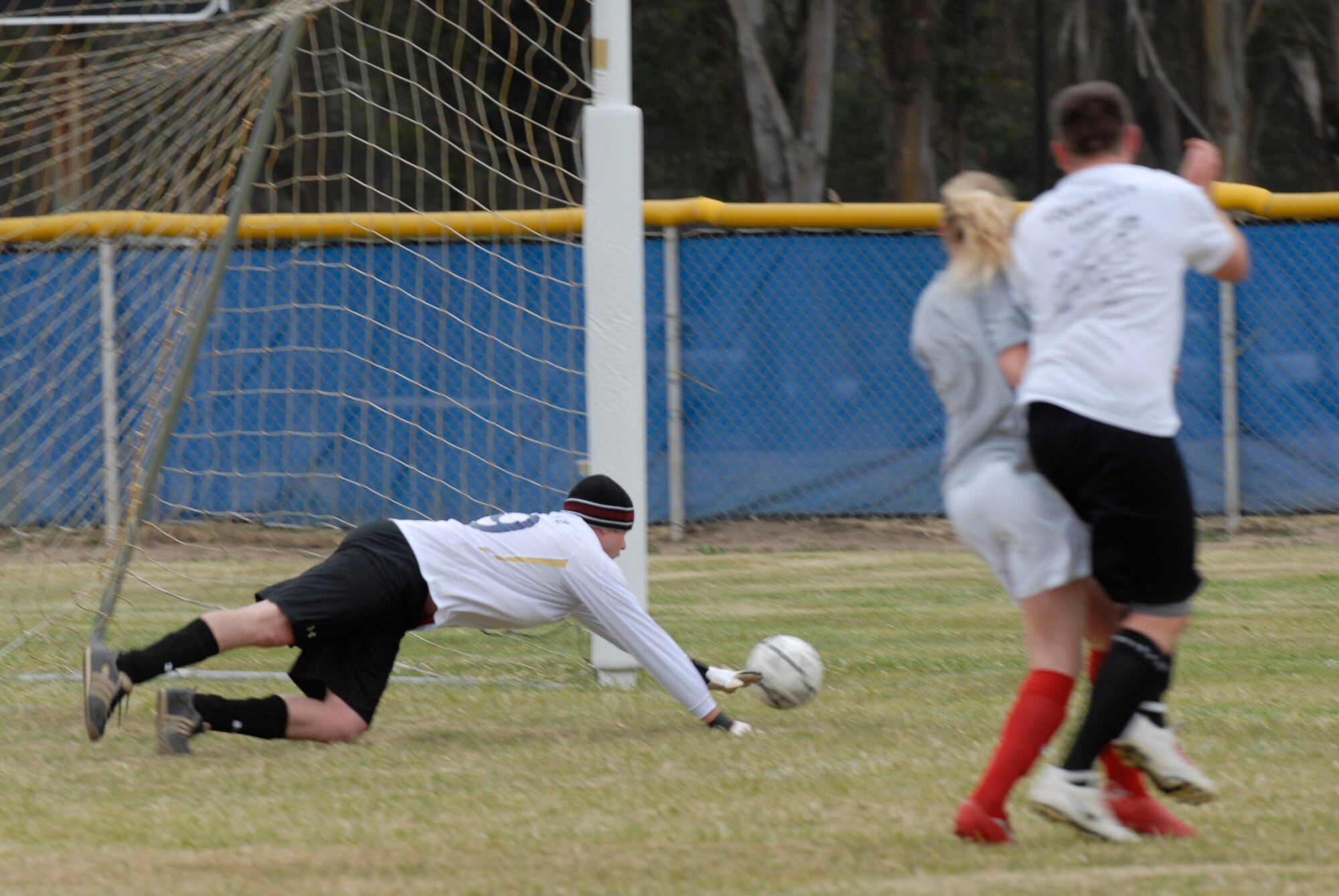 VANDENBERG AIR FORCE BASE, Calif. -- Diving to protect the goal, Thomas Giddings III, a 30th Space Communications Squadron team member, stretches for the ball during an intramural soccer game at the base field here Wednesday, May 12, 2010.  The 30th Space Communications Squadron played their game with half the amount of players, but managed to hold their own throughout the game.  (U.S. Air Force photo/Senior Airman Andrew Satran) 

 


 


 

 
