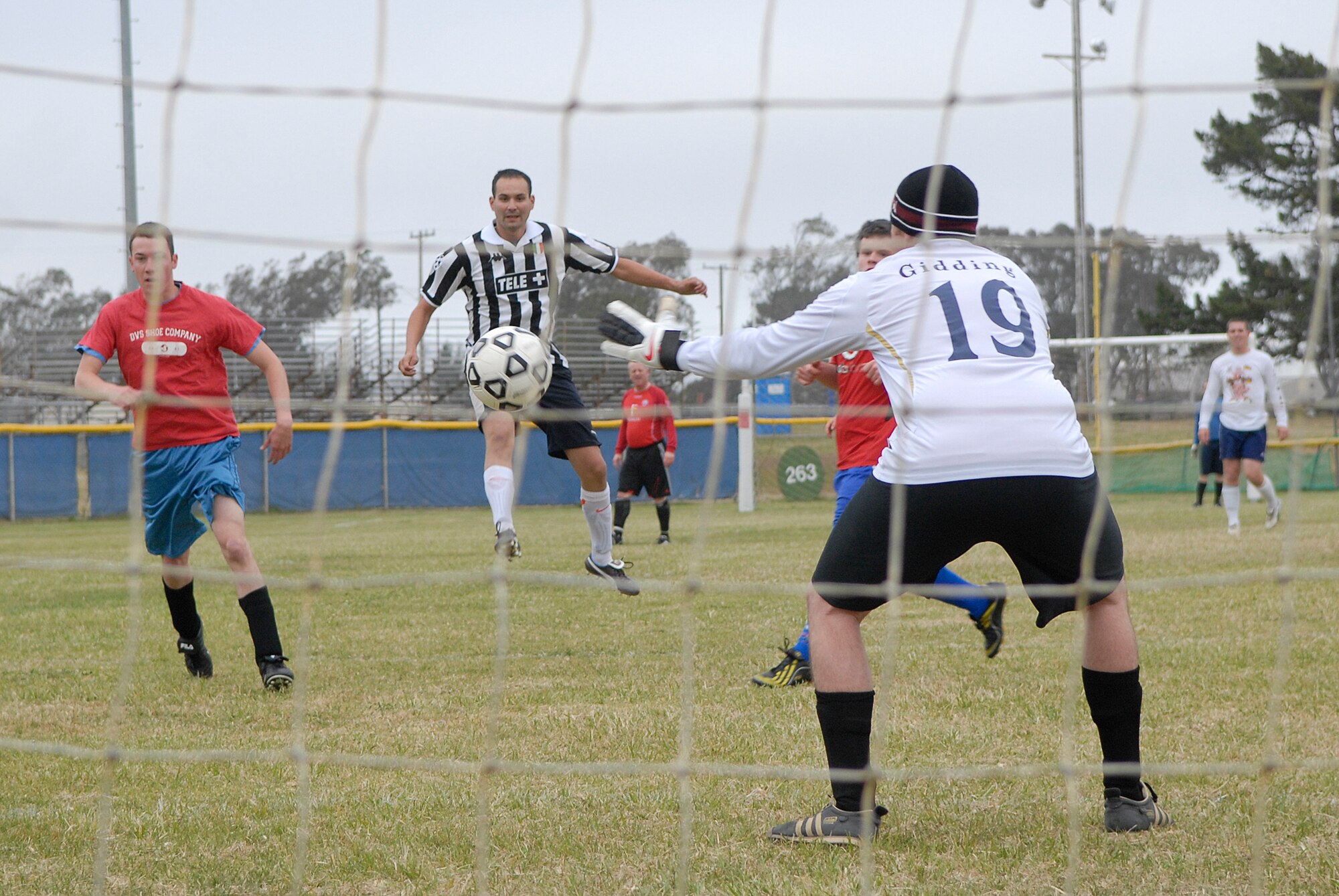 VANDENBERG AIR FORCE BASE, Calif. -- Thomas Giddings III, a 30th Space Communications Squadron team member, defends the goal against Tommy Nix, a 30th Launch Group team member, during an intramural soccer game at the base field here Wednesday, May 12, 2010.  The 30th Launch Group swept the game 9-0.  (U.S. Air Force photo/Senior Airman Andrew Satran) 

 
