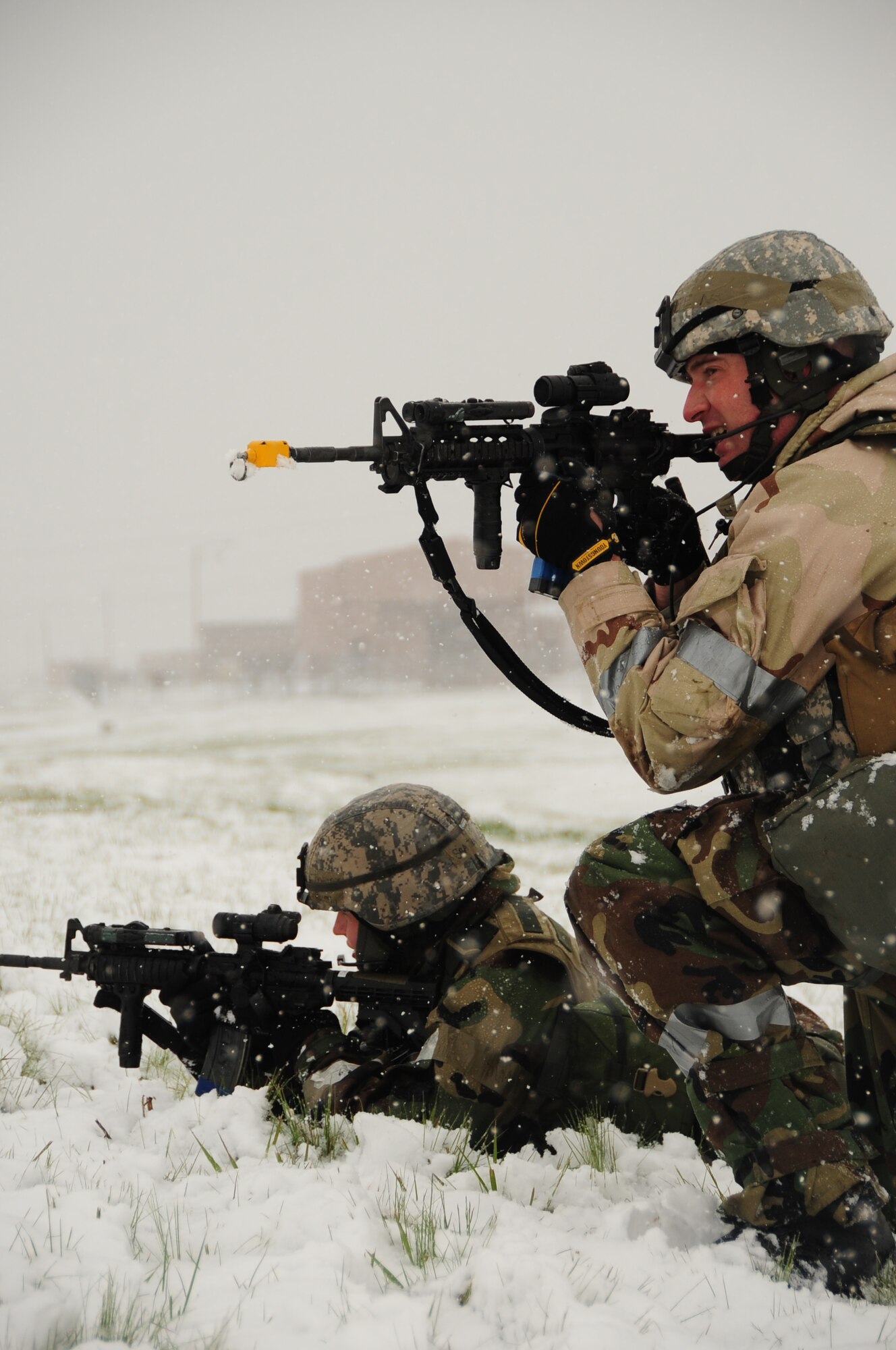 ELLSWORTH AIR FORCE BASE, S.D. – (Front to back) Staff Sgt. Benjamin Pieta and Senior Airman Kristi Terwilliger, 28th Security Forces Squadron patrolmen, scout the area for simulated threats during a phase II Operational Readiness Exercise, May 12.  During the Phase II ORE, Security Forces Airmen were tested on a variety of scenarios designed to gauge their ability to operate in the deployed environment. (U.S. Air Force photo/Airman 1st Class Anthony Sanchelli)