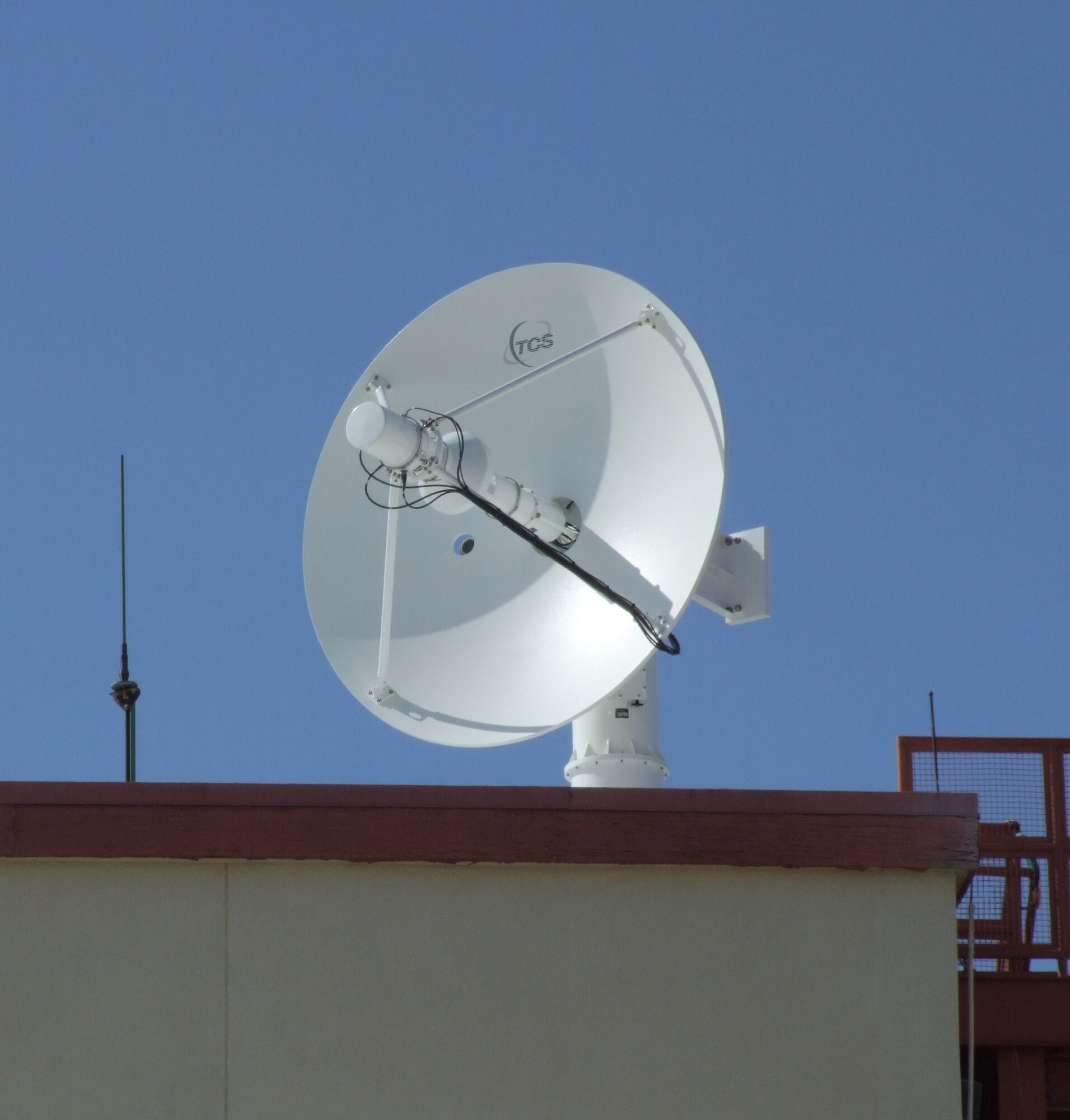 A newly installed antenna sits atop the U.S. Air Force Test Pilot School at Edwards Air Force Base, Calif. The antenna is part of a new aeronautical telemetry ground system that will allow airborne data to be transferred to the ground in the C-band frequency range, an addition to the L-band and S-band frequency ranges currently used. The new tri-band system will increase bandwidth and allow more frequencies to be used by both the civilian community and units at Edwards AFB. (Courtesy photo)