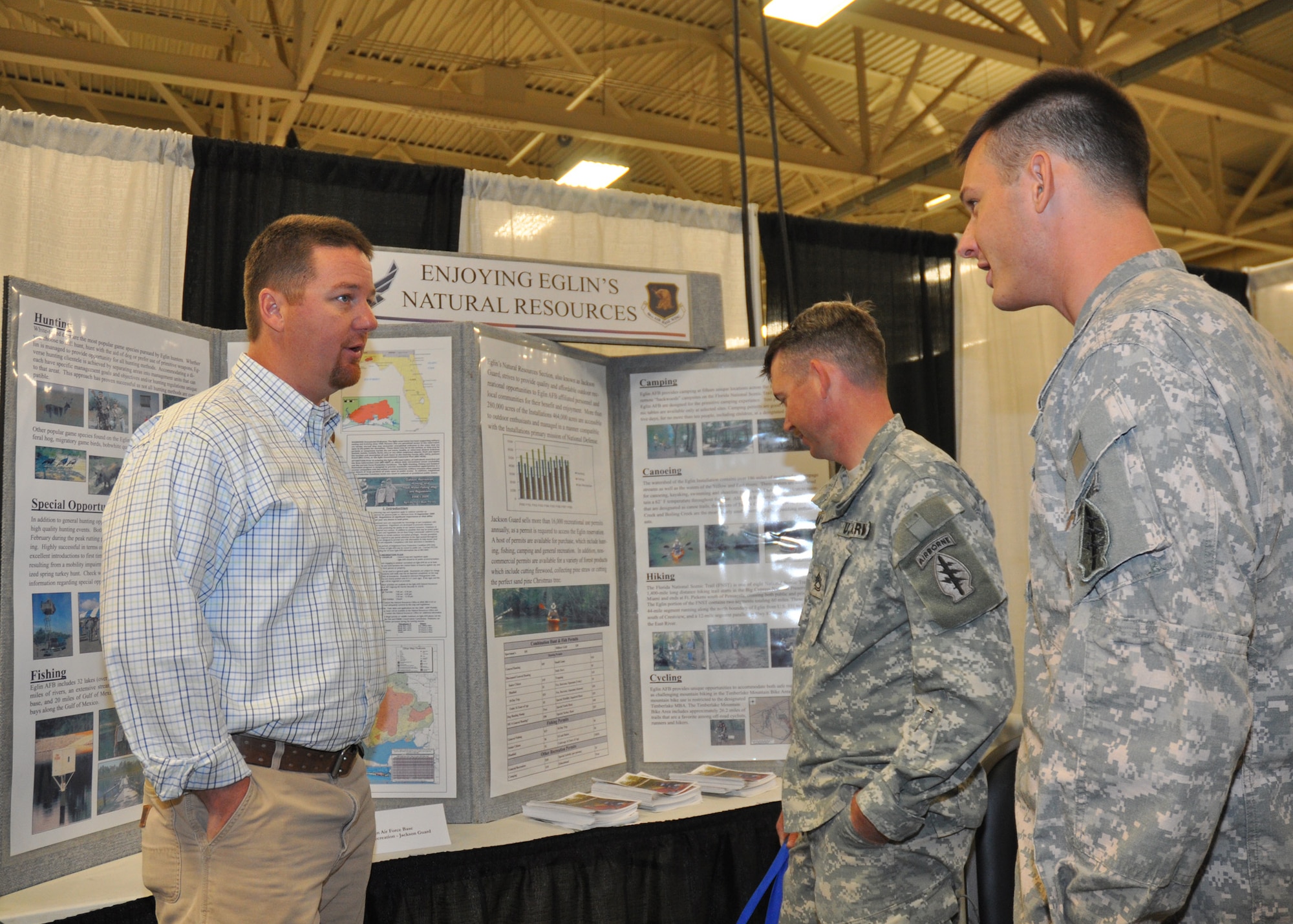 Justin Johnson, recreation coordinator for Jackson Guard, provided many 7th Special Forces Group soldiers information on recreational activities in the Eglin AFB local area May 12 at Fort Bragg, N.C.  Eglin and local area community representatives traveled to Fort Bragg to inform SFG soldiers on expectations of their  move to this area.  Over 1,500 soldiers and their families attended the third Town Hall meeting.  The town hall meetings were designed to address concerns including employment, education and housing.  (U.S. Air Force photo/Minty Knighton.)