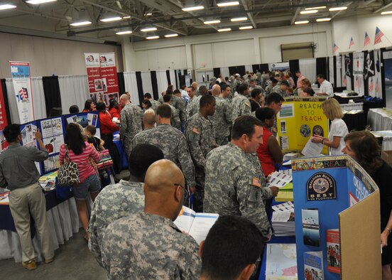 Lines of soldiers form at the information fair portion of the Town Hall meeting May 12 at Fort Bragg, N.C.  Eglin and local area community representatives traveled to Fort Bragg to inform SFG soldiers on expectations of their  move to this area.  Over 1,500 soldiers and their families attended the third Town Hall meeting.  The town hall meetings were designed to address concerns including employment, education and housing.  (U.S. Air Force photo/Minty Knighton.)