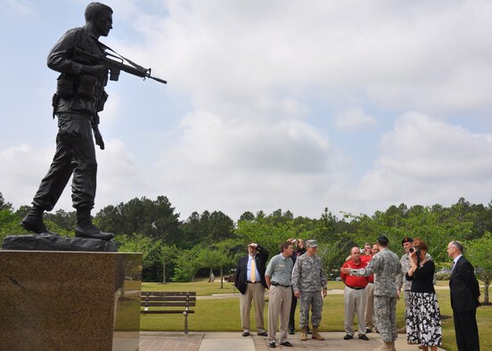 Col. James Kraft, 7th Special Forces Group commander, tells Town Hall participants from Eglin about the history of the memorial commissioned in honor of Maj. Richard Meadows May 12 at Fort Bragg, N.C.  Eglin and local area community representatives traveled to Fort Bragg to inform SFG soldiers on expectations of their  move to this area.  Over 1,500 soldiers and their families attended the third Town Hall meeting.  The town hall meetings were designed to address concerns including employment, education and housing.  (U.S. Air Force photo/Minty Knighton.)