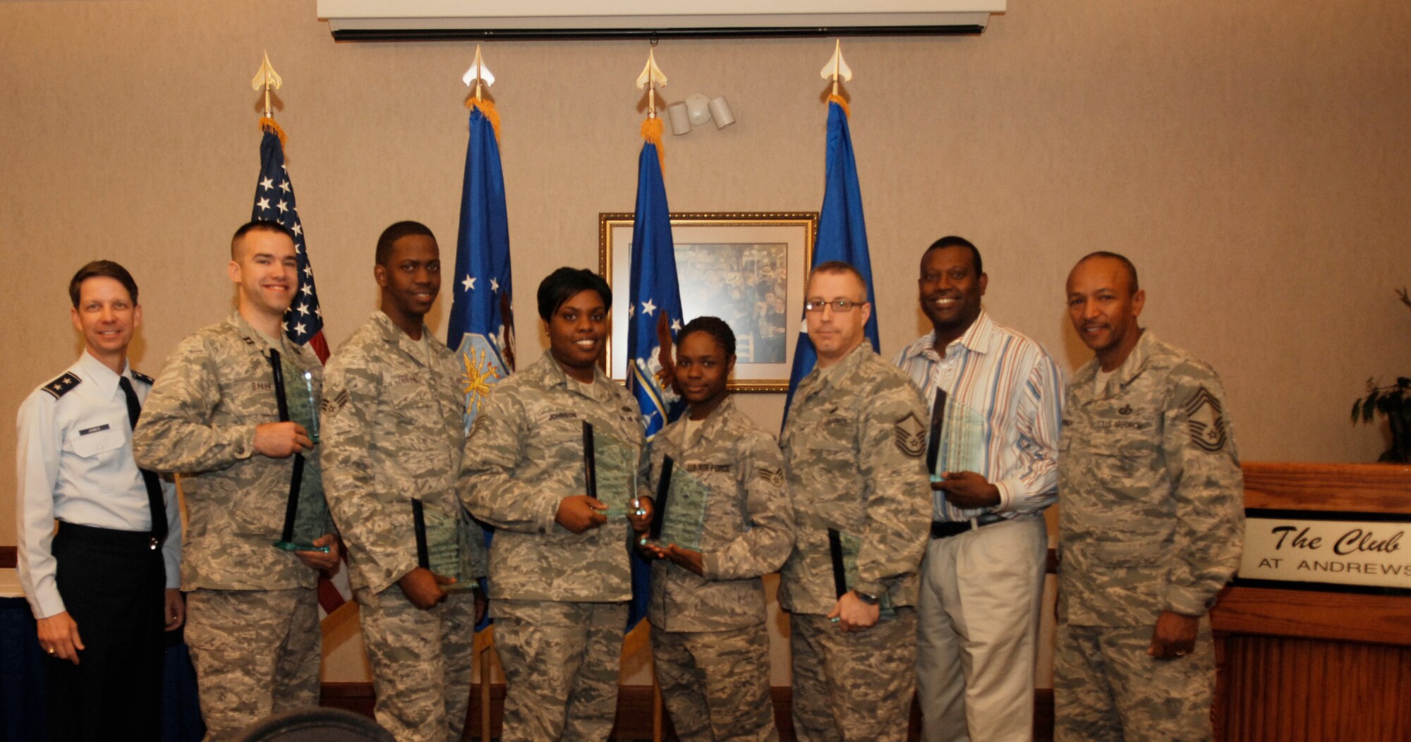 From Left: Air Force District of Washington Commander Maj. Gen. Darrell D. Jones stands with the AFDW Quarterly Award Winners. CGO of the Quarter, Capt. Christopher Baker, AFDW/JA. Military Volunteer of the Quarter, Senior Airman Clary Griffin, AFDW/CCK. NCO of the Quarter, Staff Sgt. Nicole R. Johnson, AFDW/A1. Airman of the Quarter, Senior Airman Tiffany Miles, AFDW/CCK. Senior NCO of the Quarter, Master Sgt. Barry Snyder, AFDW Contracting. Category II Civlian of the Quarter, Anthony Hill, AFDW Contracting. Chief Master Sgt. William Henderson of AFDW A/7 acted as a senior enlisted representative. Not pictured is the category III Civilian of the Quarter, Brian Klimek, AFDW/JA. Awards were presented at The Club on Andrews AFB, Md. May 11, 2010. 