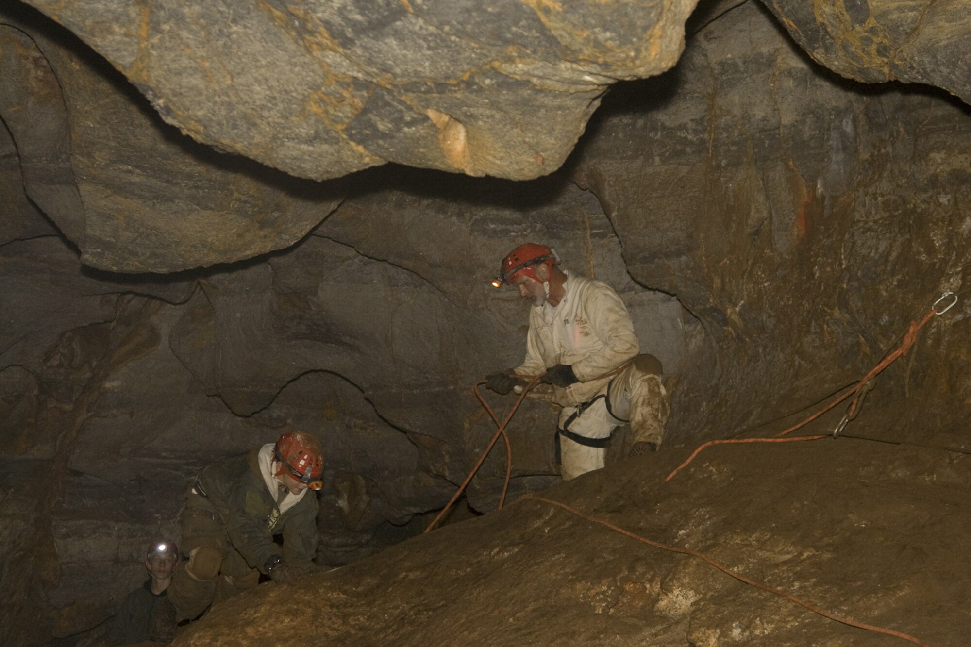 Jim Beisel, Outdoor Recreation adventure programmer, helps guide some young enthusiasts through Lick Creek Cave on an ODR expedition. (U.S. Air Force Courtesy Photo)