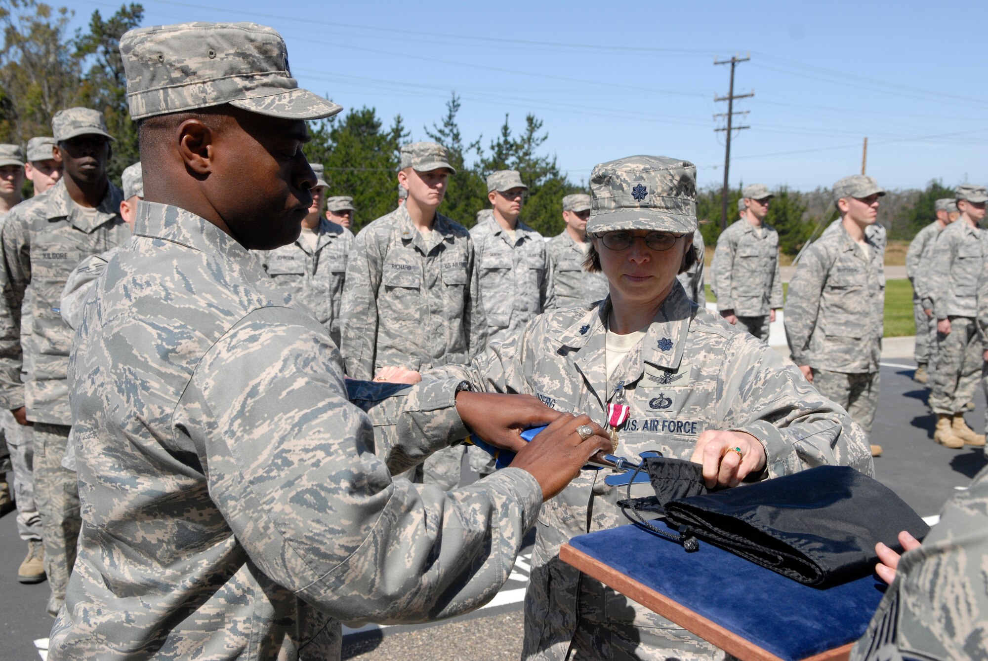 VANDENBERG AIR FORCE BASE, Calif. -- Col. Lavanson Coffey III, the 30th Launch Group commander, and Lt. Col. Elana Oberg, the 30th Launch Support Squadron commander, prepare the casing of the guidon during the 30th LCSS inactivation ceremony in front of the 30th LCG here Wednesday, May 12, 2010.  Members from the 30th LCSS will transfer to the 1st Air and Space Test Squadron, 4th Space Launch Squadron and the 30th LCG. (U.S. Air Force photo/Senior Airman Andrew Satran) 
