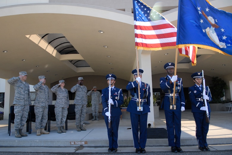 VANDENBERG AIR FORCE BASE, Calif. – Ceremonial guardsmen from the Vandenberg Honor Guard present the colors during the 30th Launch Support Squadron inactivation ceremony in front of the 30th Launch Group headquarters building here Wednesday, May 12, 2010.  After nearly five years, the 30th LCSS will close its doors and integrate with other squadrons at Vandenberg due to manpower and budget reasons. (U.S. Air Force photo/Senior Airman Andrew Satran) 
