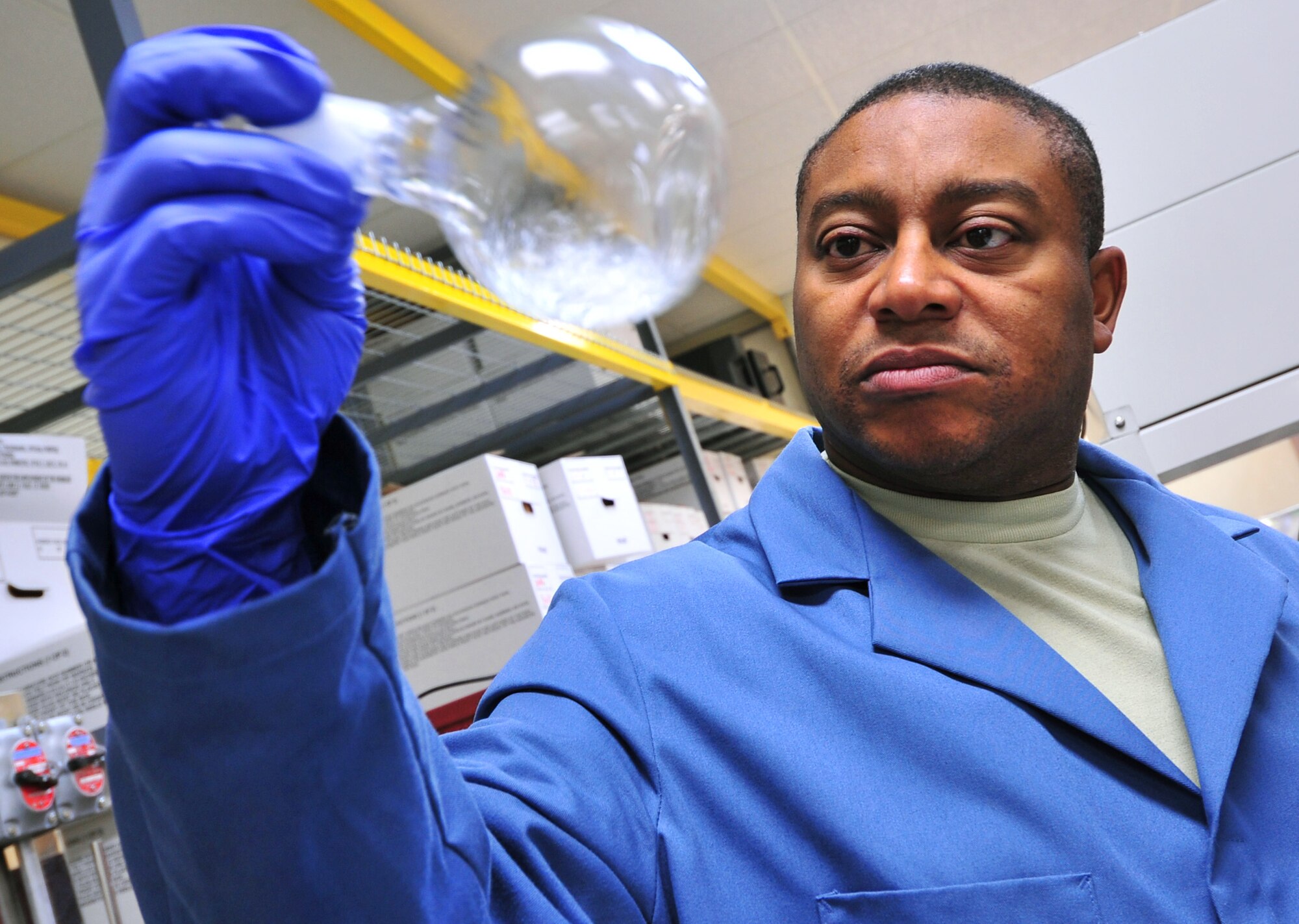 Tech. Sgt. James Thompson analyzes samples for the presence of polychlorinated biphenyls, a toxic group of chemicals commonly found in older electrical transformers, Jan. 13, 2010, at Kadena Air Base, Japan. Sergeant Thompson is a Det. 3, U.S. Air Force School of Aerospace Medicine lab technician. (U.S. Air Force photo/Tech. Sgt. Rey Ramon)