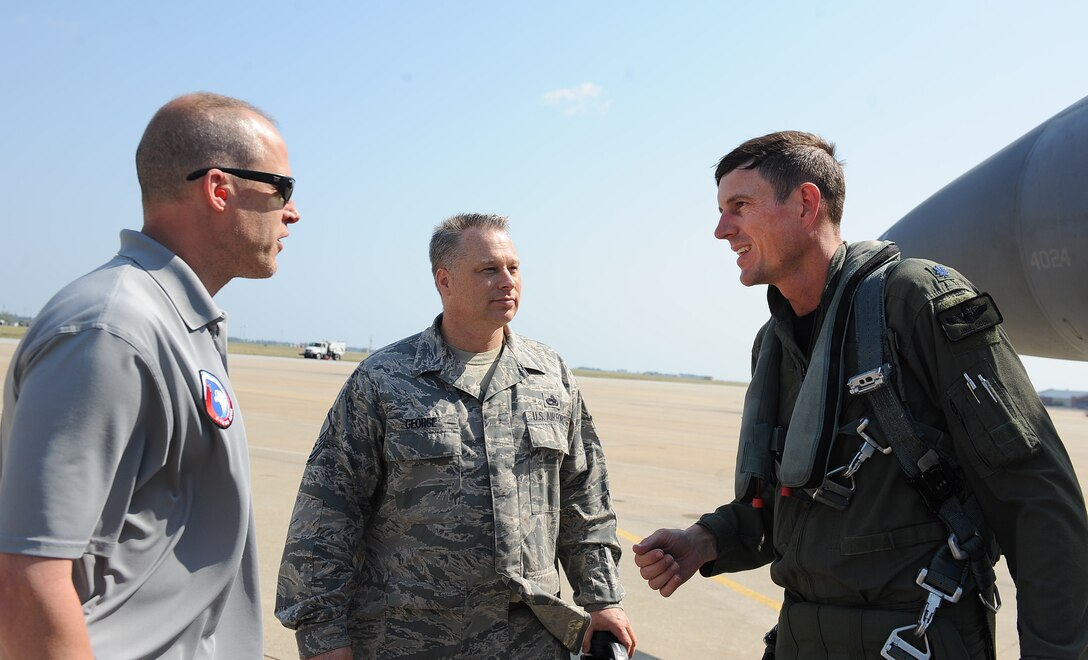 LANGLEY AIR FORCE BASE, Va. - Lt. Col. Joel Cook, 71st Fighter Squadron commander, talks with Eric Petrucci, Boeing representative, and Master Sgt. William George, 71 FS second liason after his flight in an F-15 Eagle equipped with the V3 radar. The flight marks its first active duty operational flight for the radar, which would turn the F-15s into multi-role fighters. (U.S. Air Force photo/Airman 1st Class Gul Crockett)