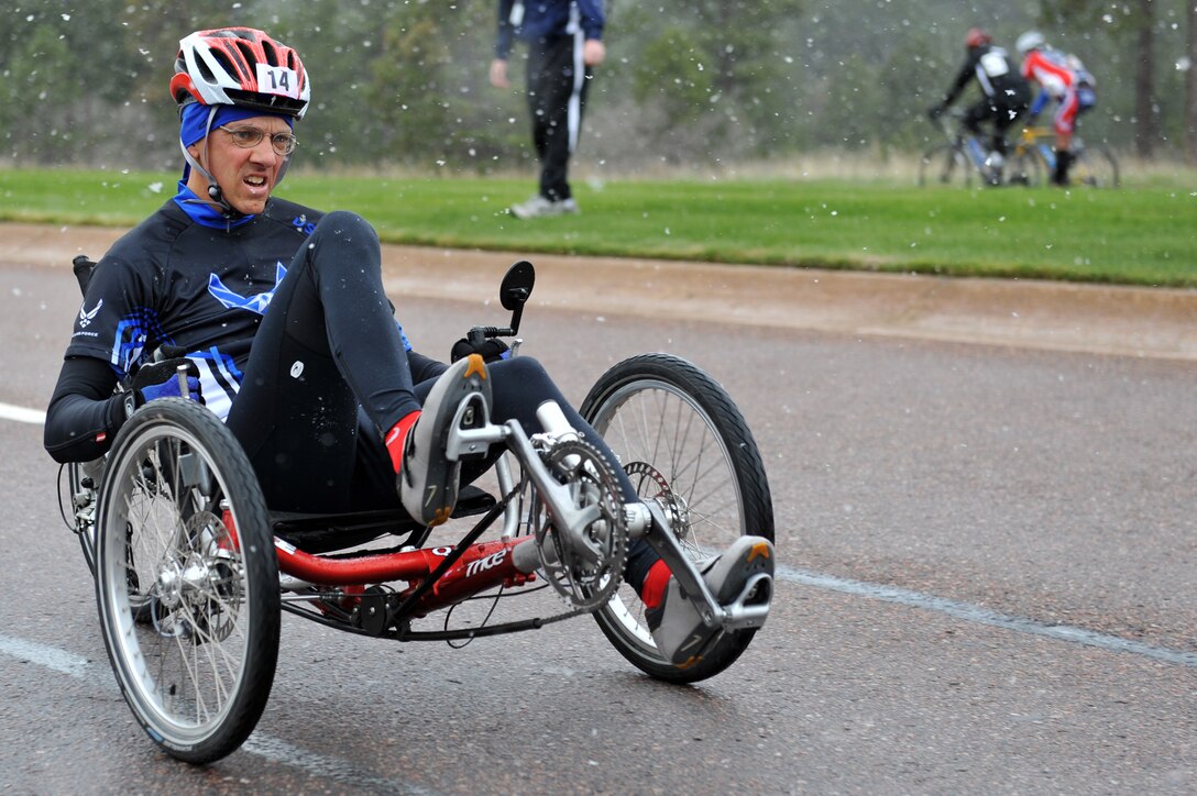Senior Master Sgt. Michael Sanders races to the finish line of the 10-kilometer recumbent bike race  for the inaugural Warrior Games May 13, 2010, at the U.S. Air Force Academy in Colorado Springs, Colo. Sergeant Sanders is one of some 200 disabled veterans participating in the Paralympic-style competition May 10 through 14. (U.S. Air Force photo/Staff Sgt. Desiree N. Palacios)